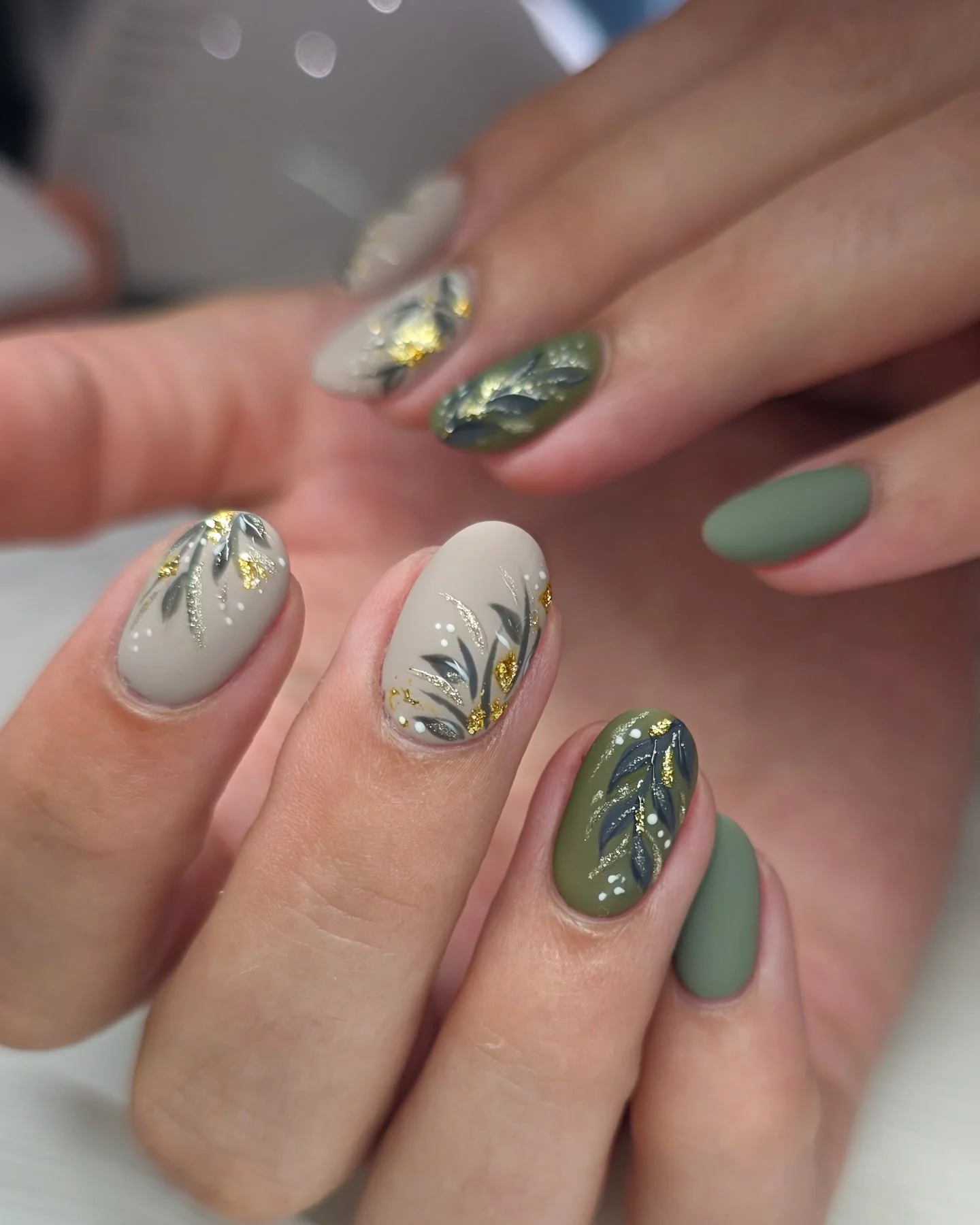 fall manicure 2026 Sage Green Botanical Nails With Elegant Gold Accents