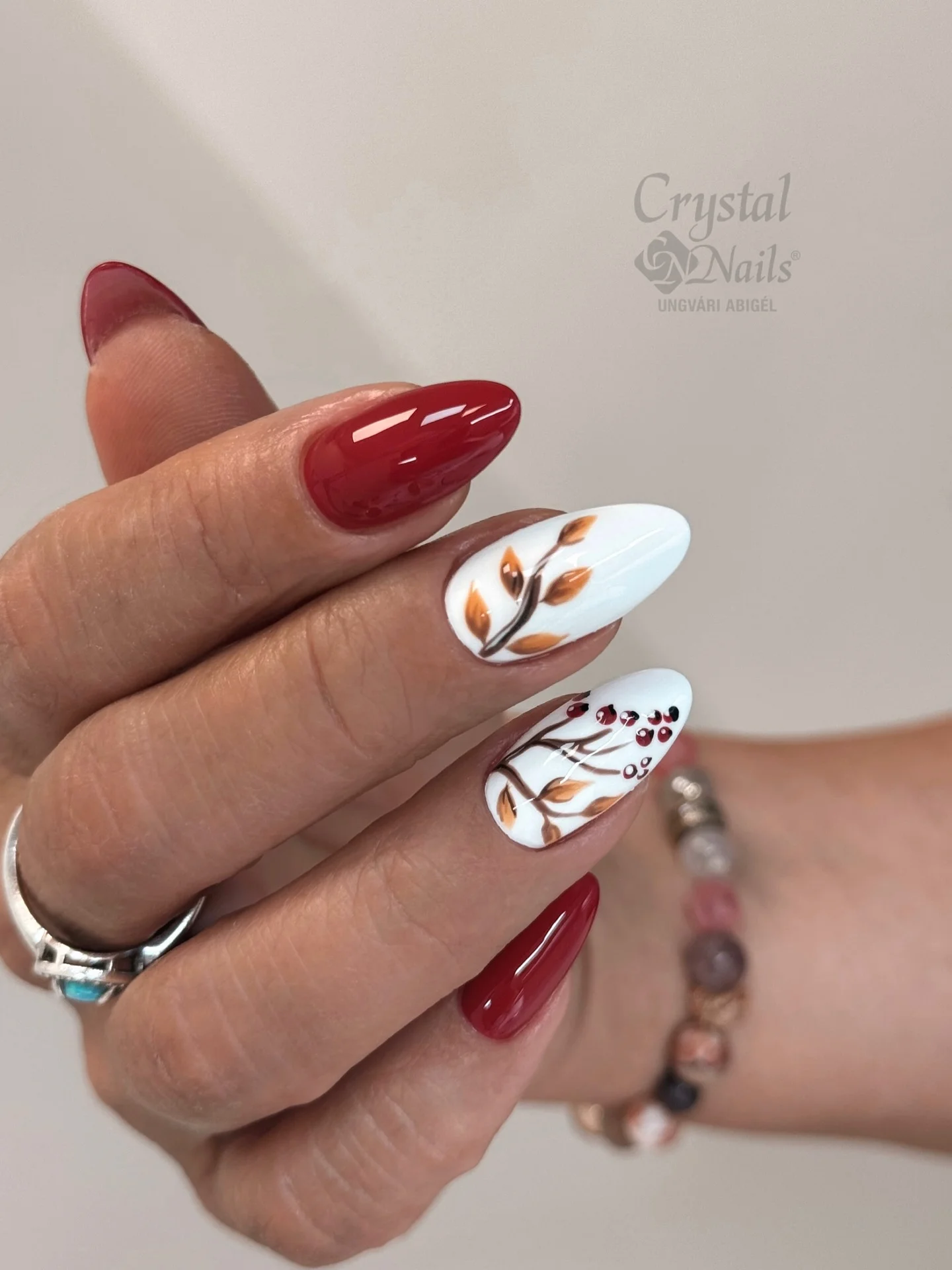 september nail art ideas 2026 Elegant Burgundy Almond Nails With Minimal Autumn Branches