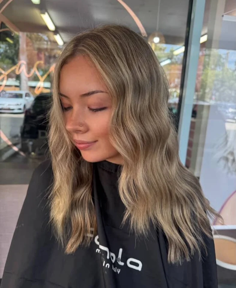 dirty blonde hair color Relaxed Wavy Lob With Subtle Blonde Contrast