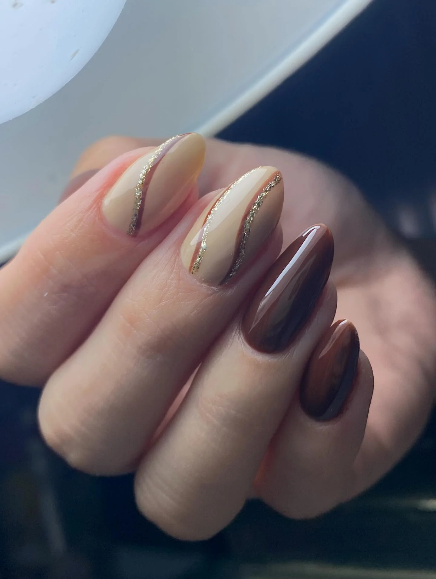 september nail designs 2026 Soft Beige Almond Nails With Fine Gold Ribbons