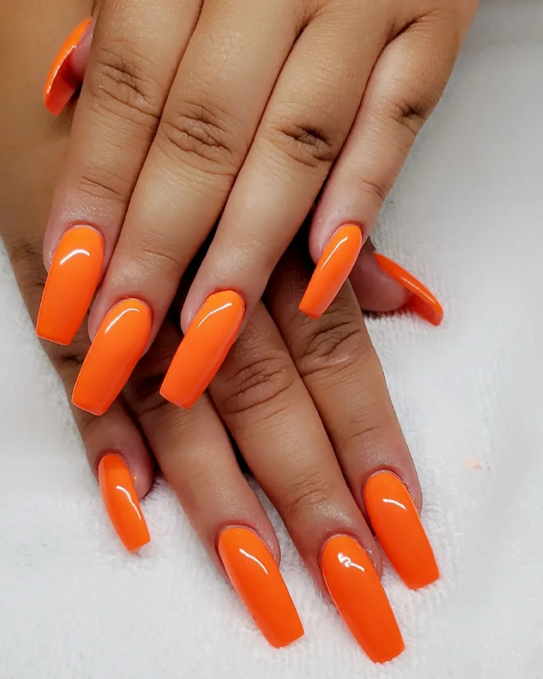 best nail colors for august 2026 Electric Tangerine Acrylic Nails That Keep Summer Alive
