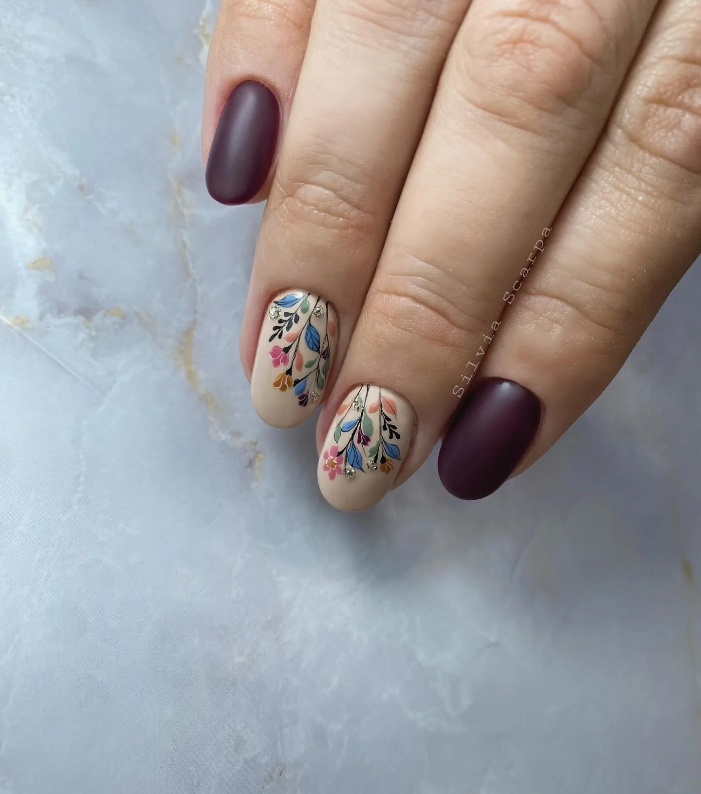 september nail art ideas 2026 Elegant Matte Plum Nails With Delicate Botanical Art