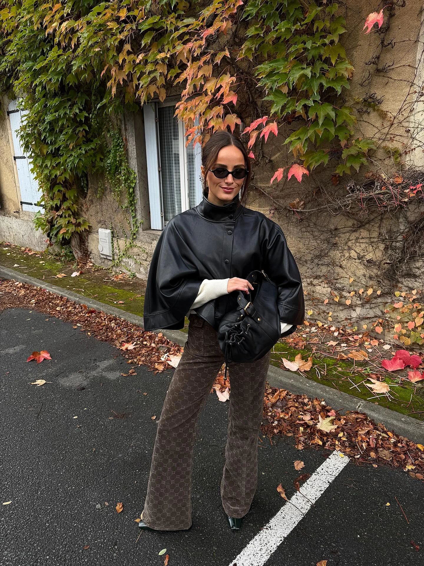 september fashion trends 2026 Modern Leather Cape Styling With Soft Neutral Contrast