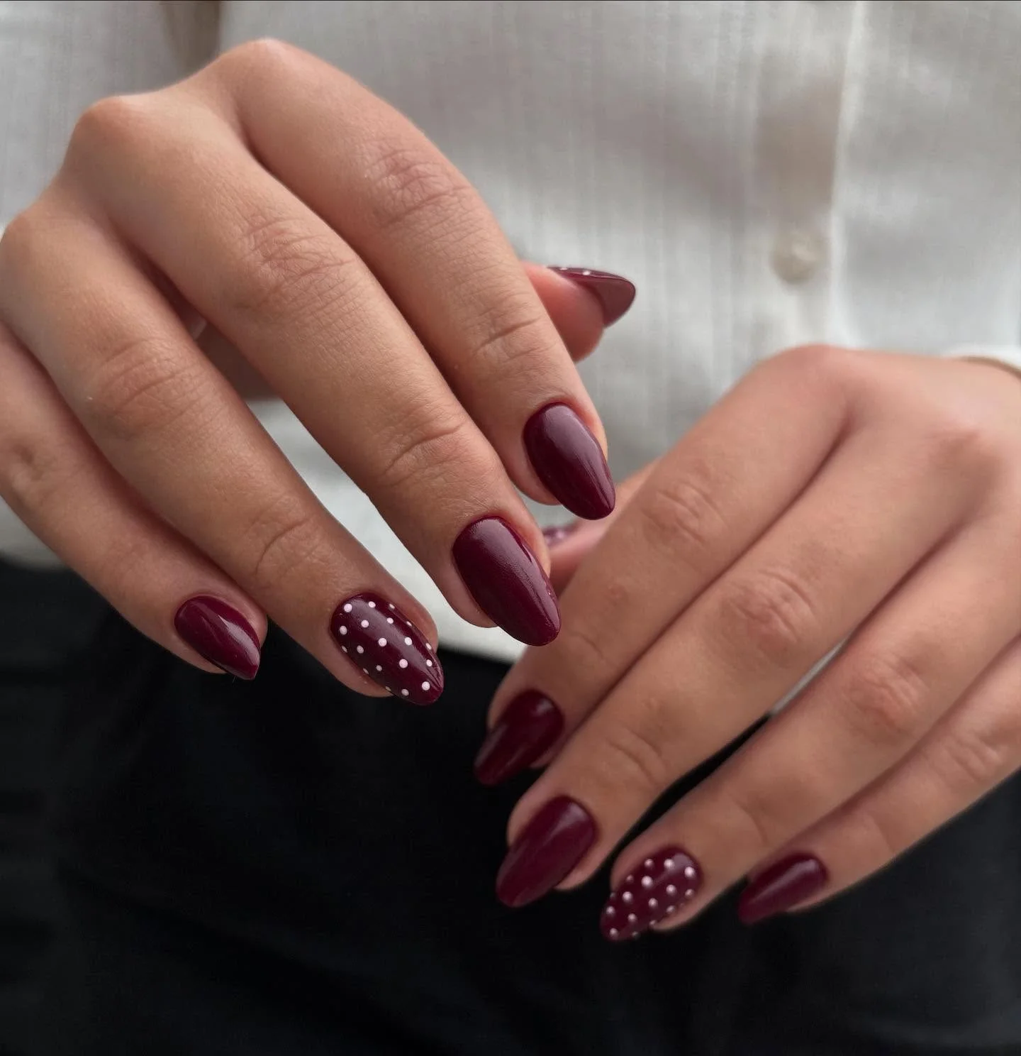 fall burgundy nails with design Glossy Burgundy Almond Nails With Polka Dot Detail