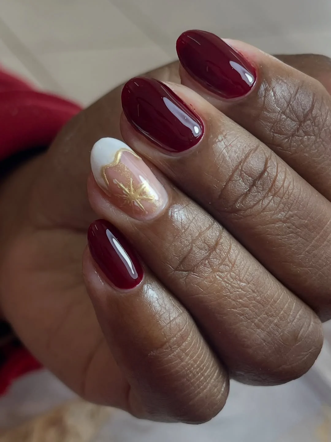 fall nails for dark skin 2026 Rich Burgundy Nails With A Delicate Golden Accent