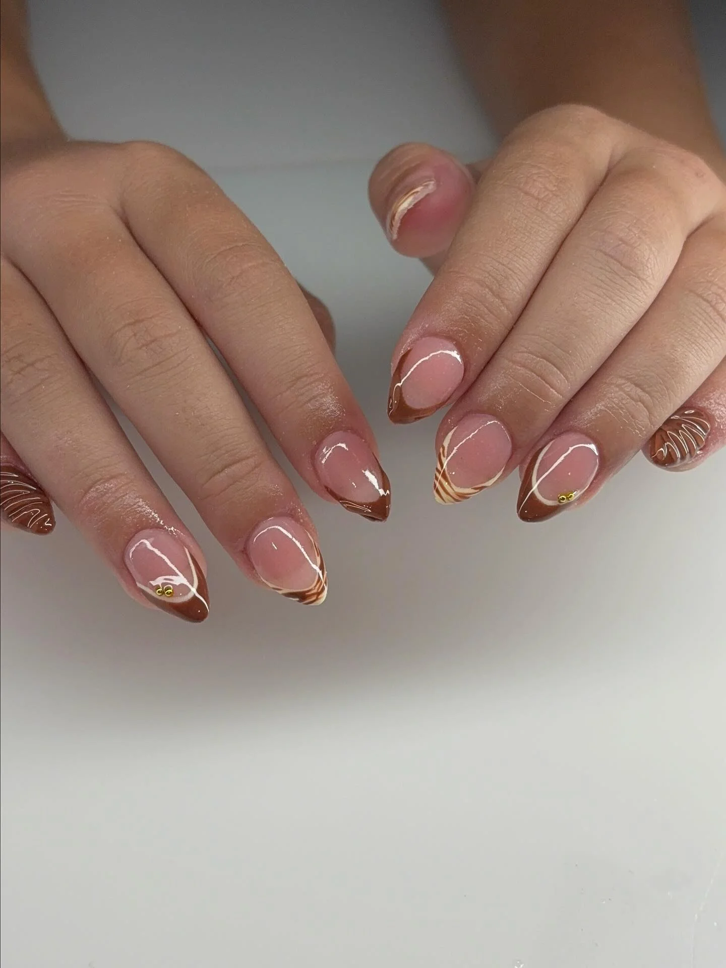 fall short almond nails 2026 Mocha Swirl Almond Tips With Modern Autumn Lines