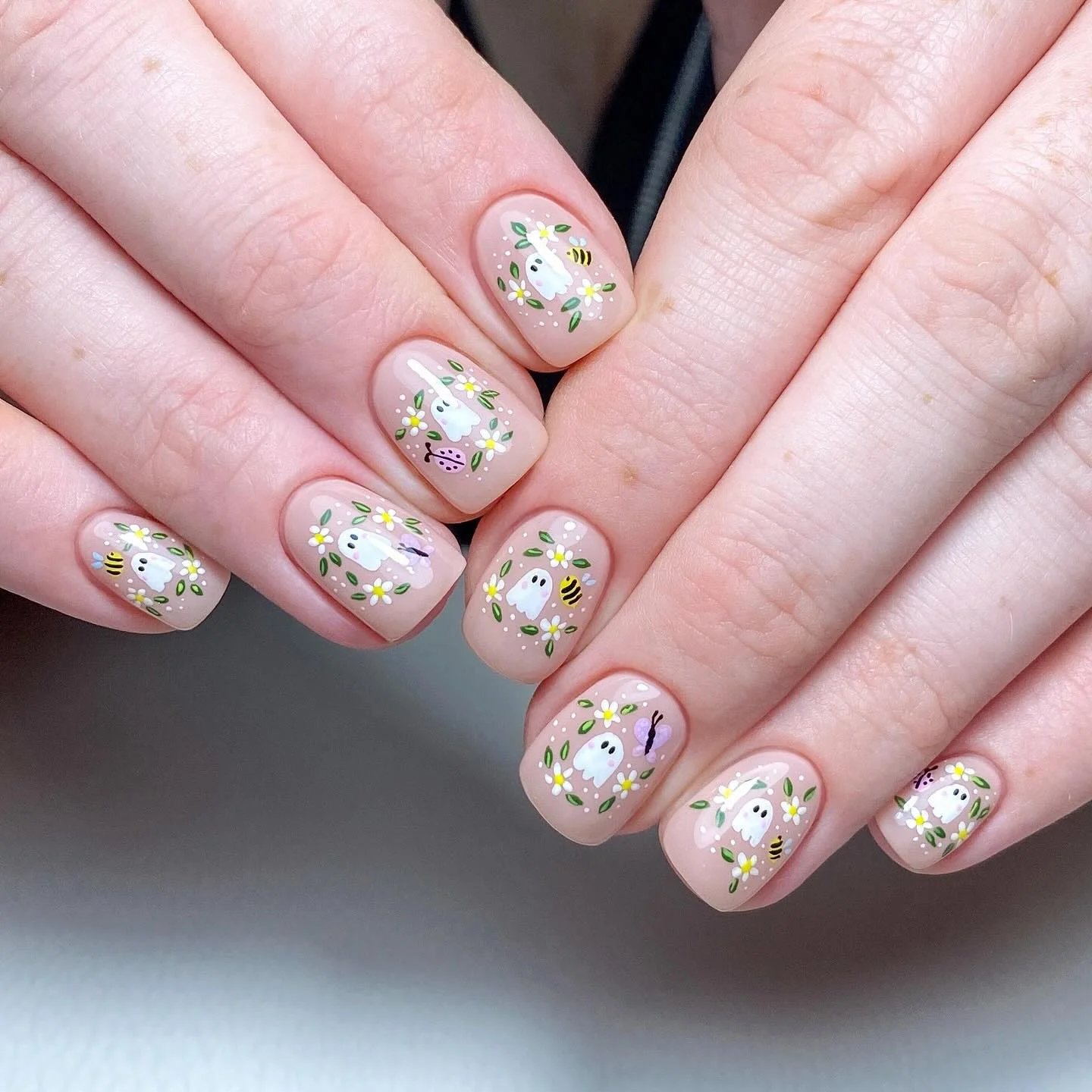 halloween nails designs 2026 Cute Ghosts And Wildflowers On Soft Pink Nails