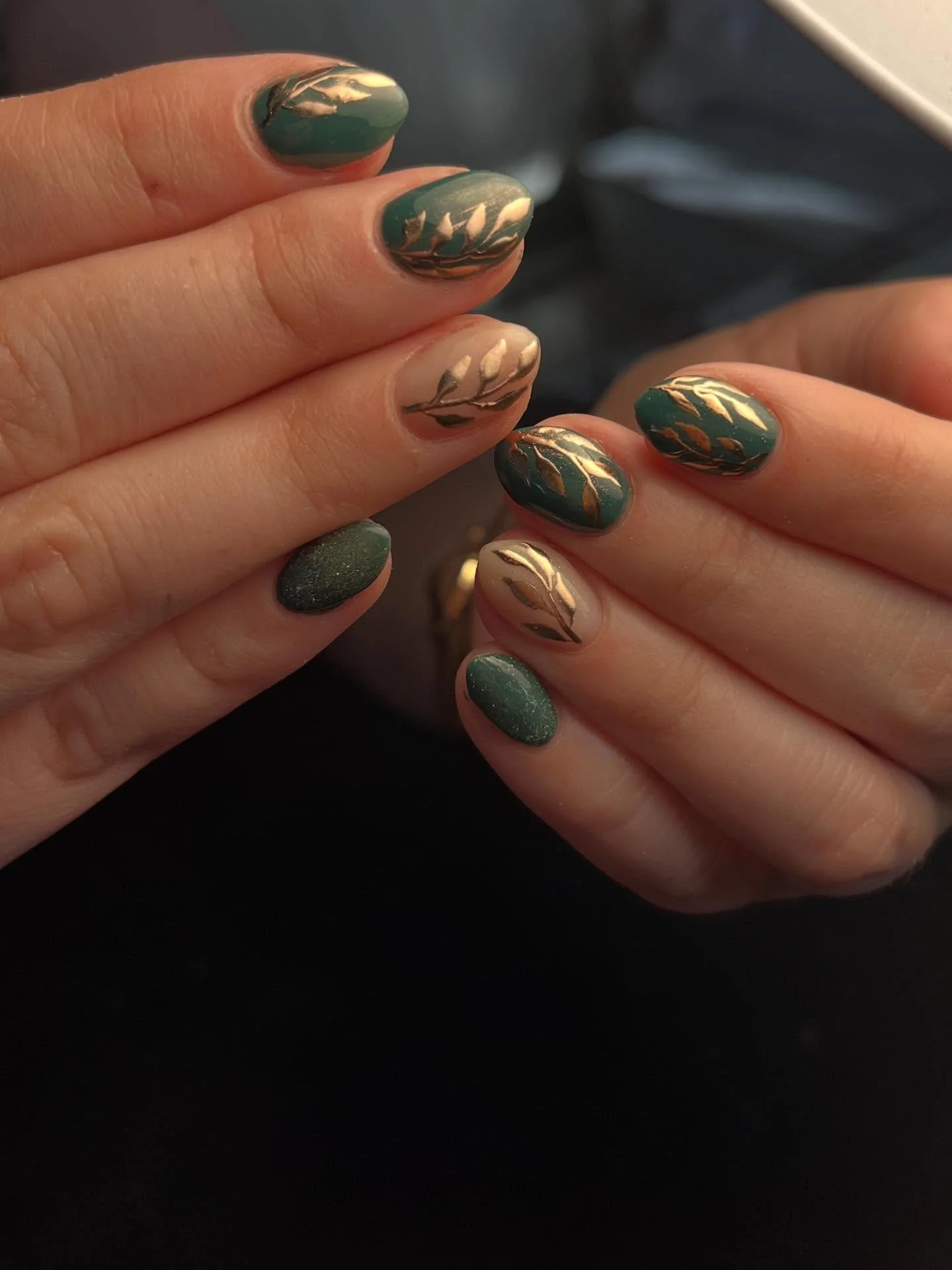 dark fall nails 2026 Forest Green Nails With Metallic Leaf Art