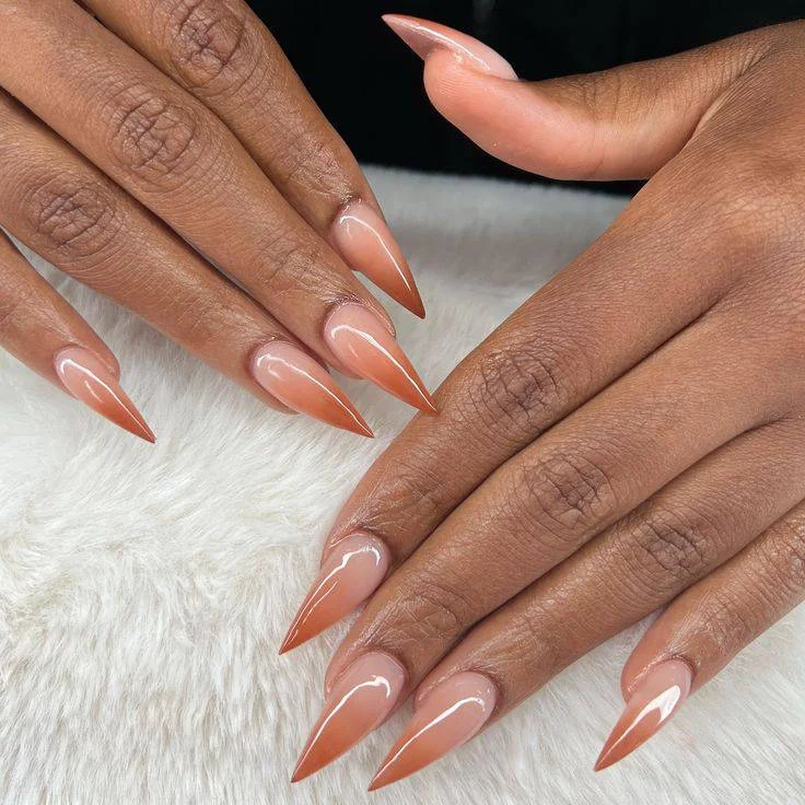 fall nails for dark skin 2026 Glossy Cinnamon Almond Nails For Effortless Autumn Style