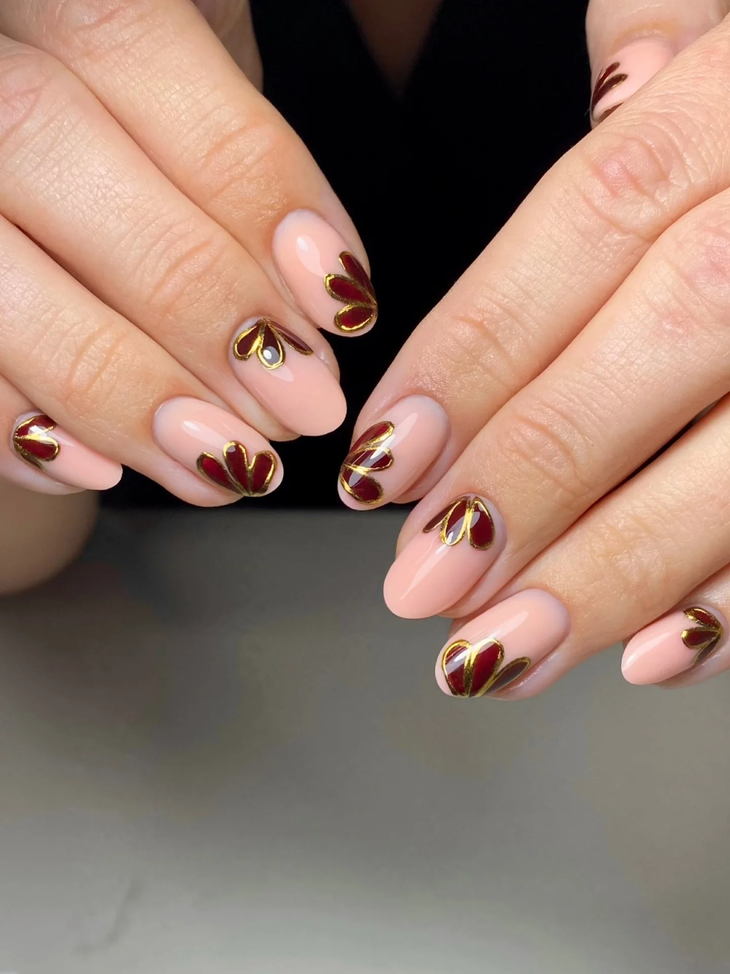 fall nails for fair skin tones 2026 Blush Pink With Burgundy And Gold Petal Details