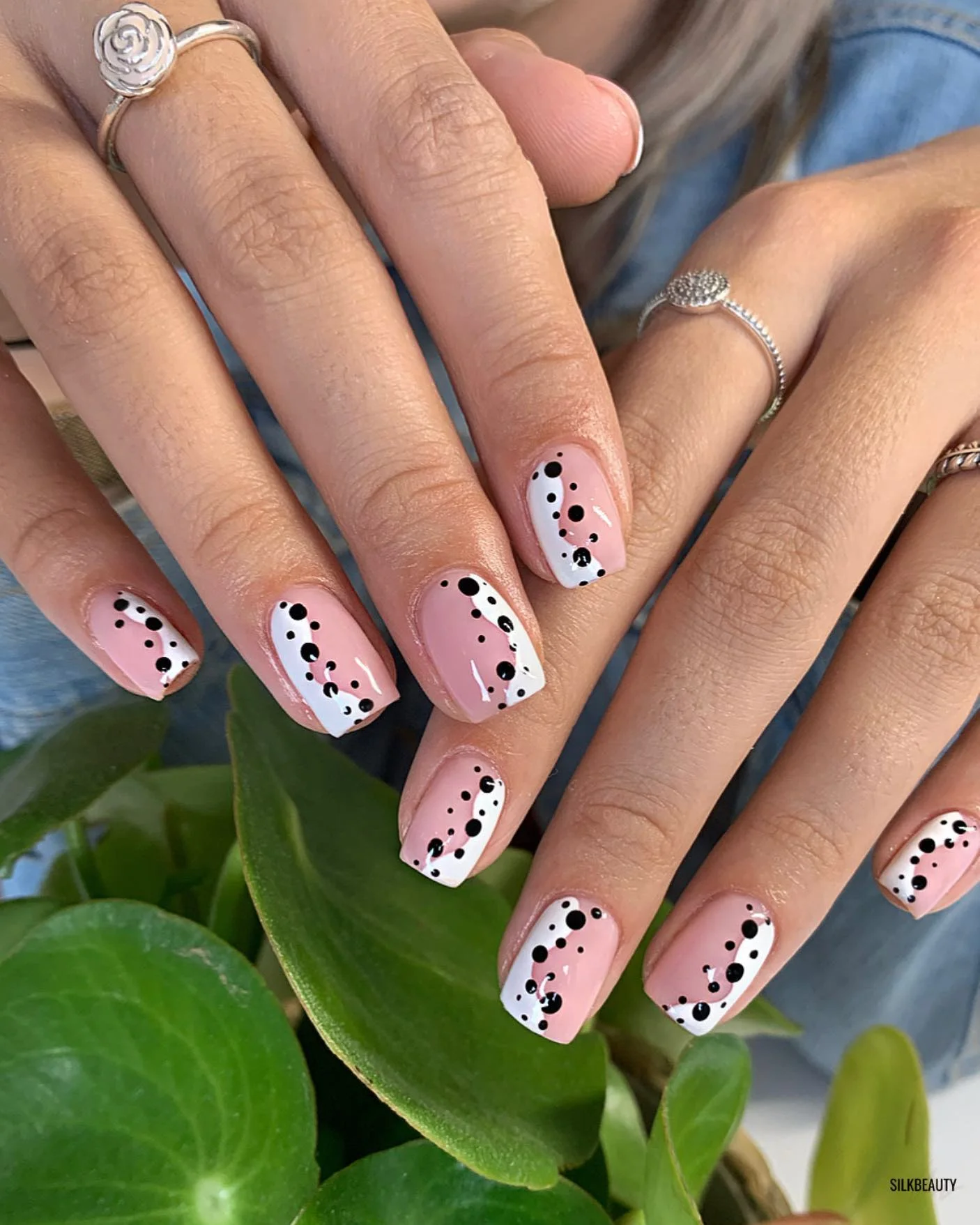 fall trendy nails 2026 Pink And Black Dot Art With A Modern Twist