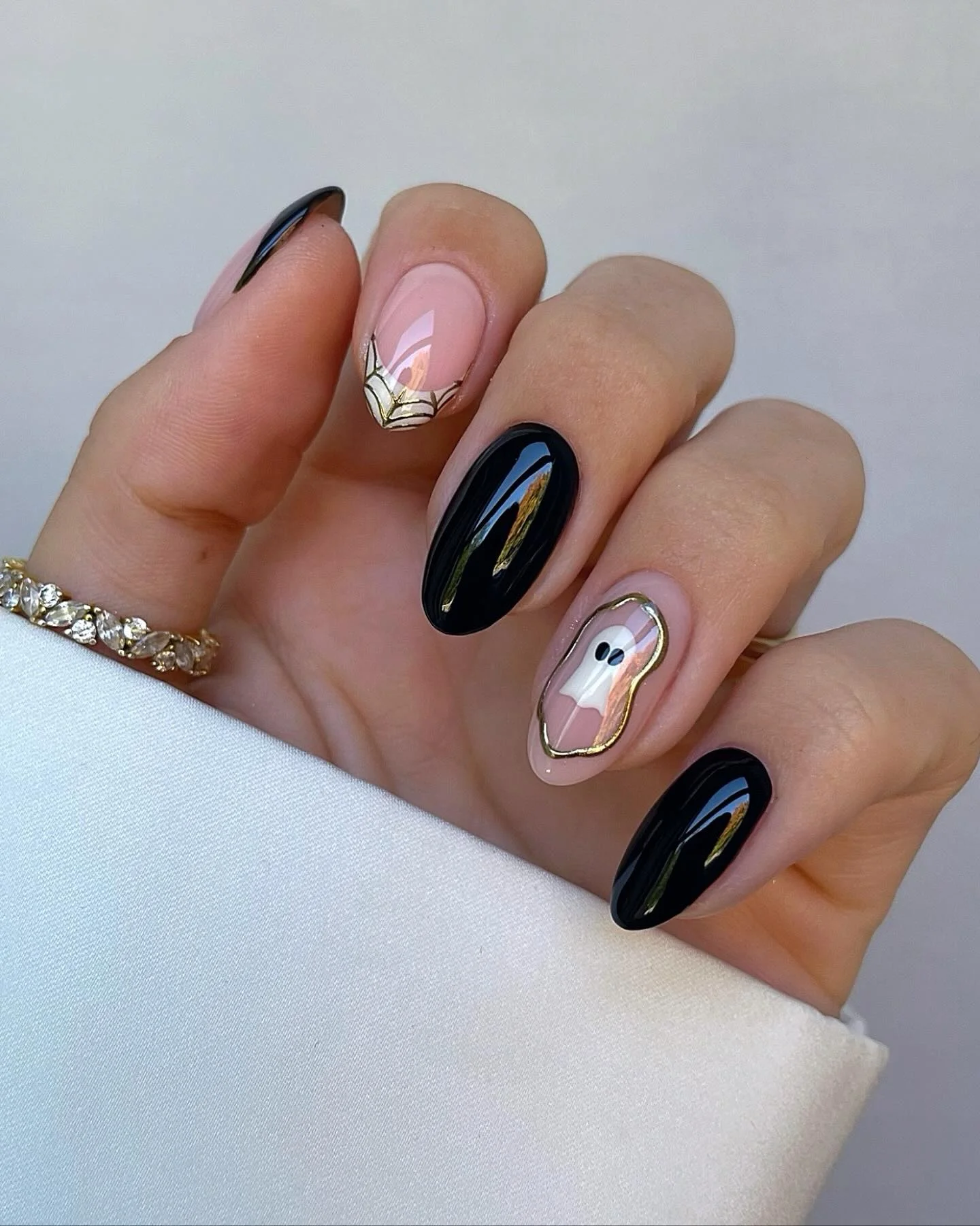 halloween nails designs 2026 Black And Blush Halloween Nails With A Golden Ghost