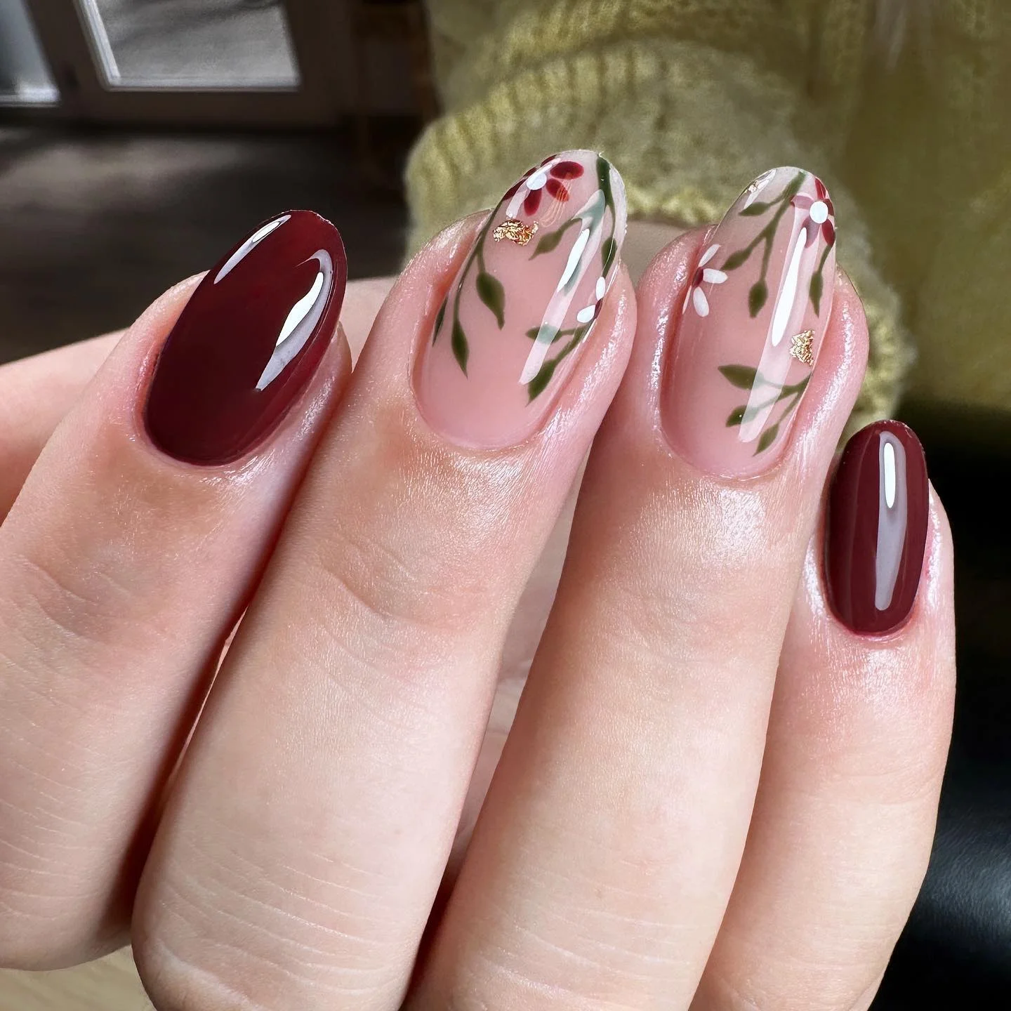 maroon fall nails 2026 Delicate Burgundy Floral Nails With Glossy Accents