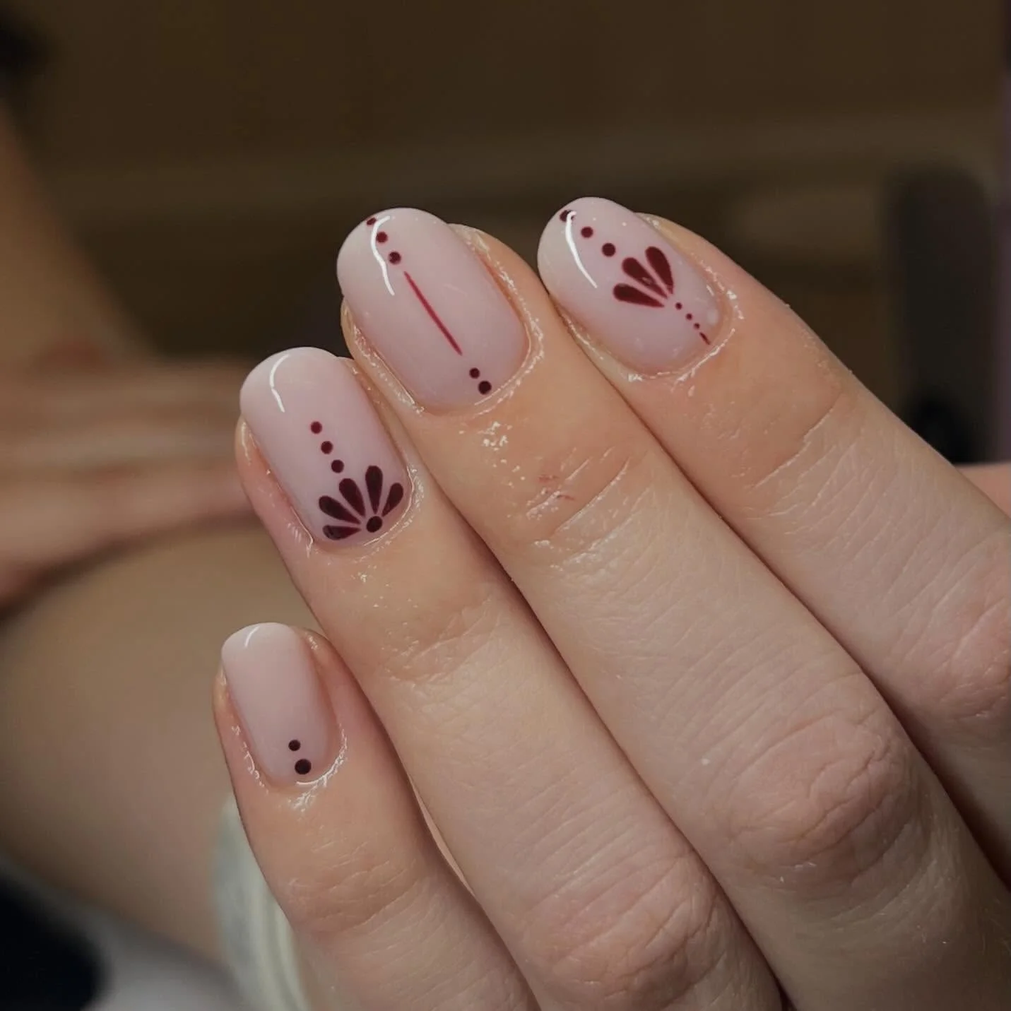 nude fall nails 2026 Soft Blush Nude With Burgundy Petal Details