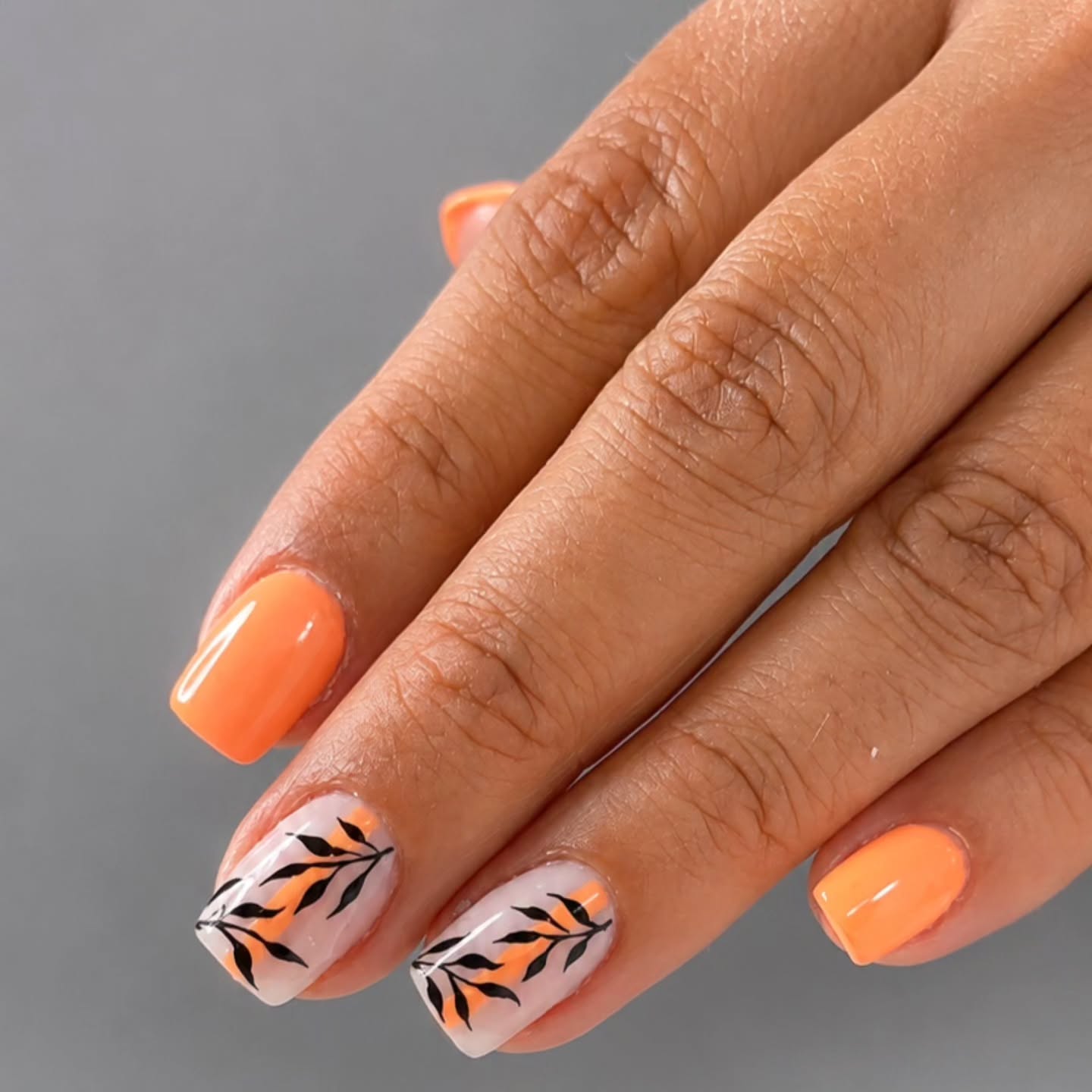 fall nails for tan skin tone Bright Pumpkin Orange Nails With Delicate Leaf Art