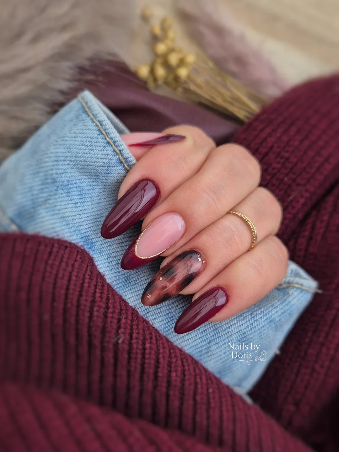 maroon fall nails 2026 Glossy Burgundy Almond Nails With Tortoiseshell Detail