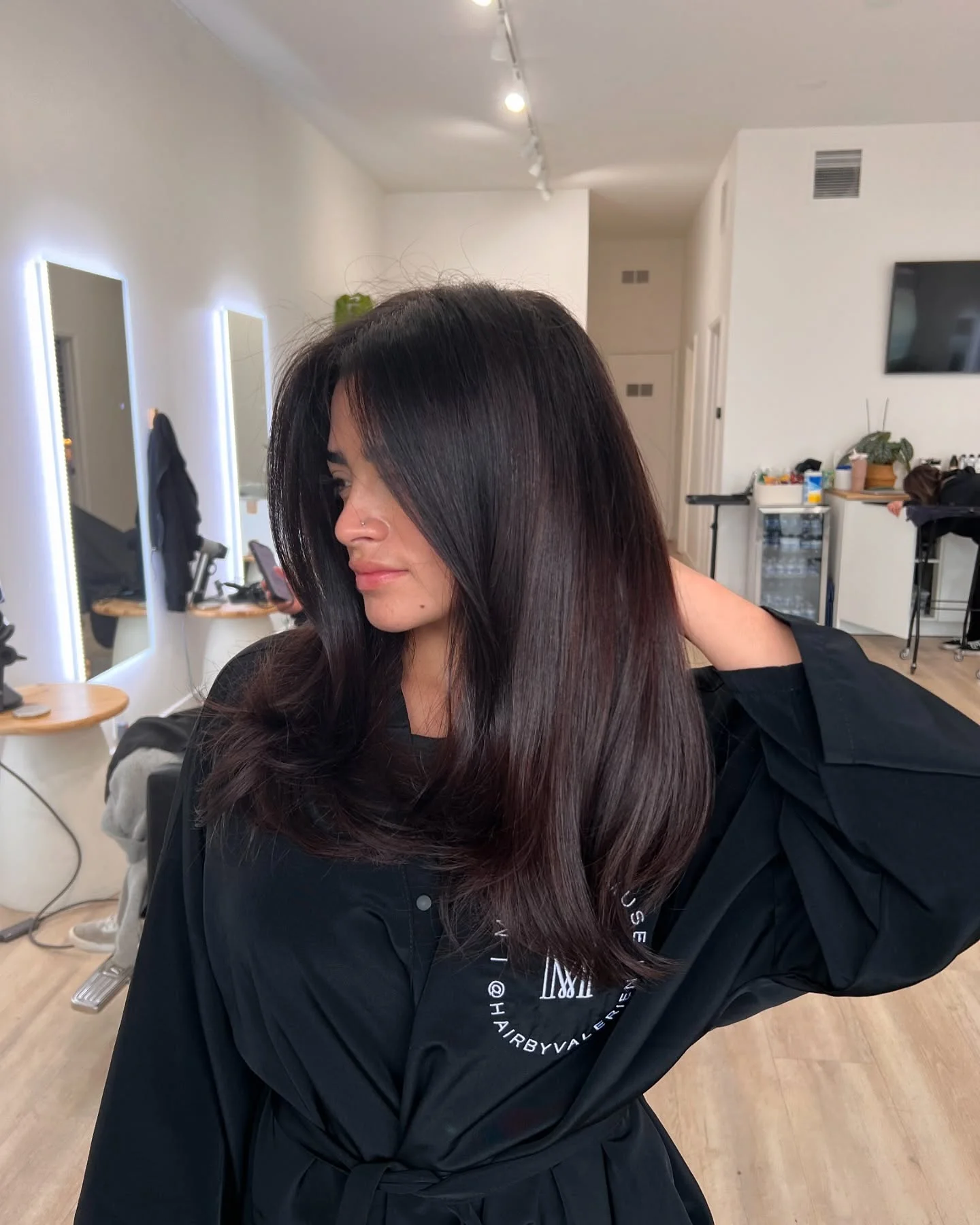 september hair color trends 2026 Glossy Espresso Brunette With Curtain Bangs