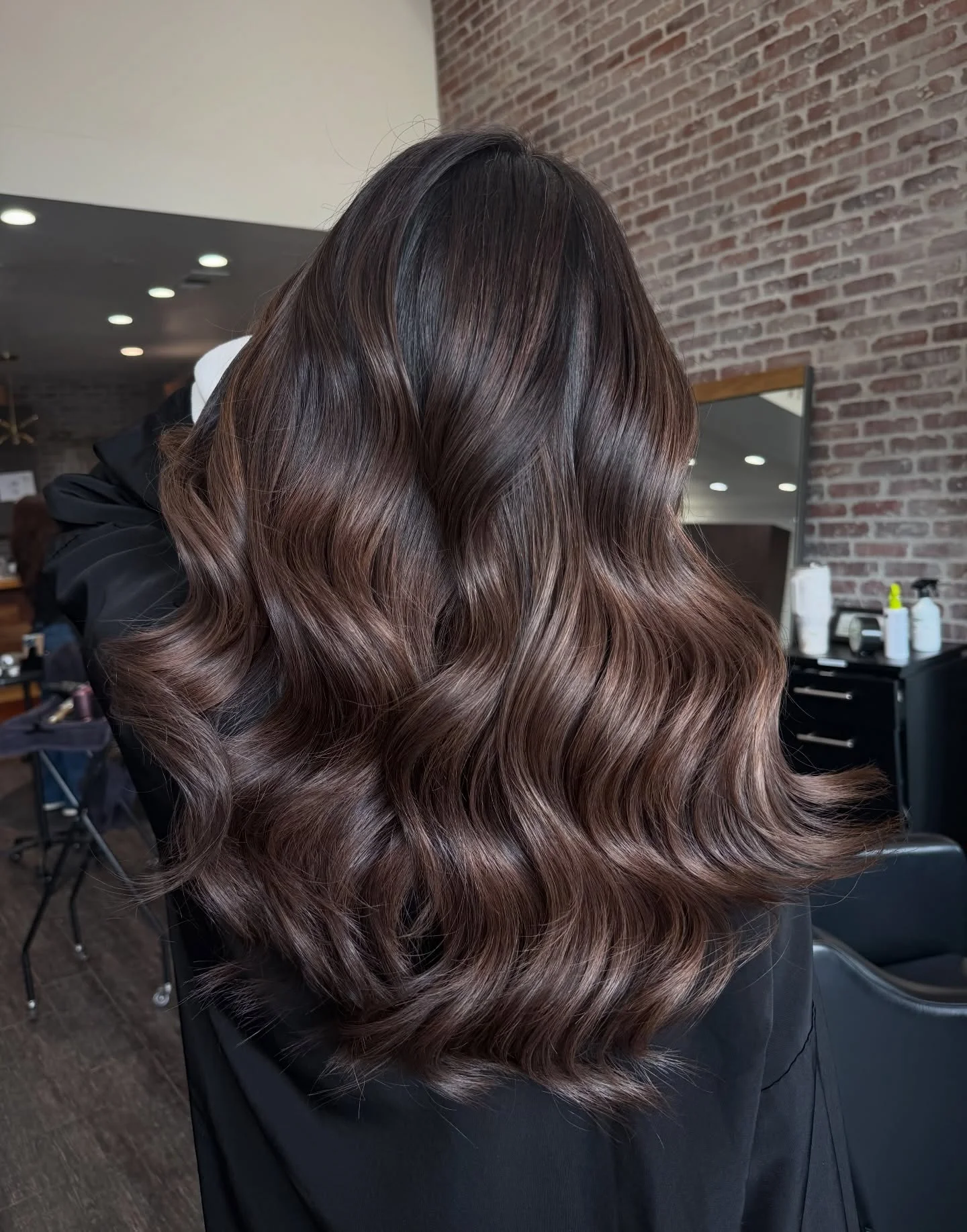 fall brown hair color ideas 2026 Deep Espresso Waves With Velvet Shine