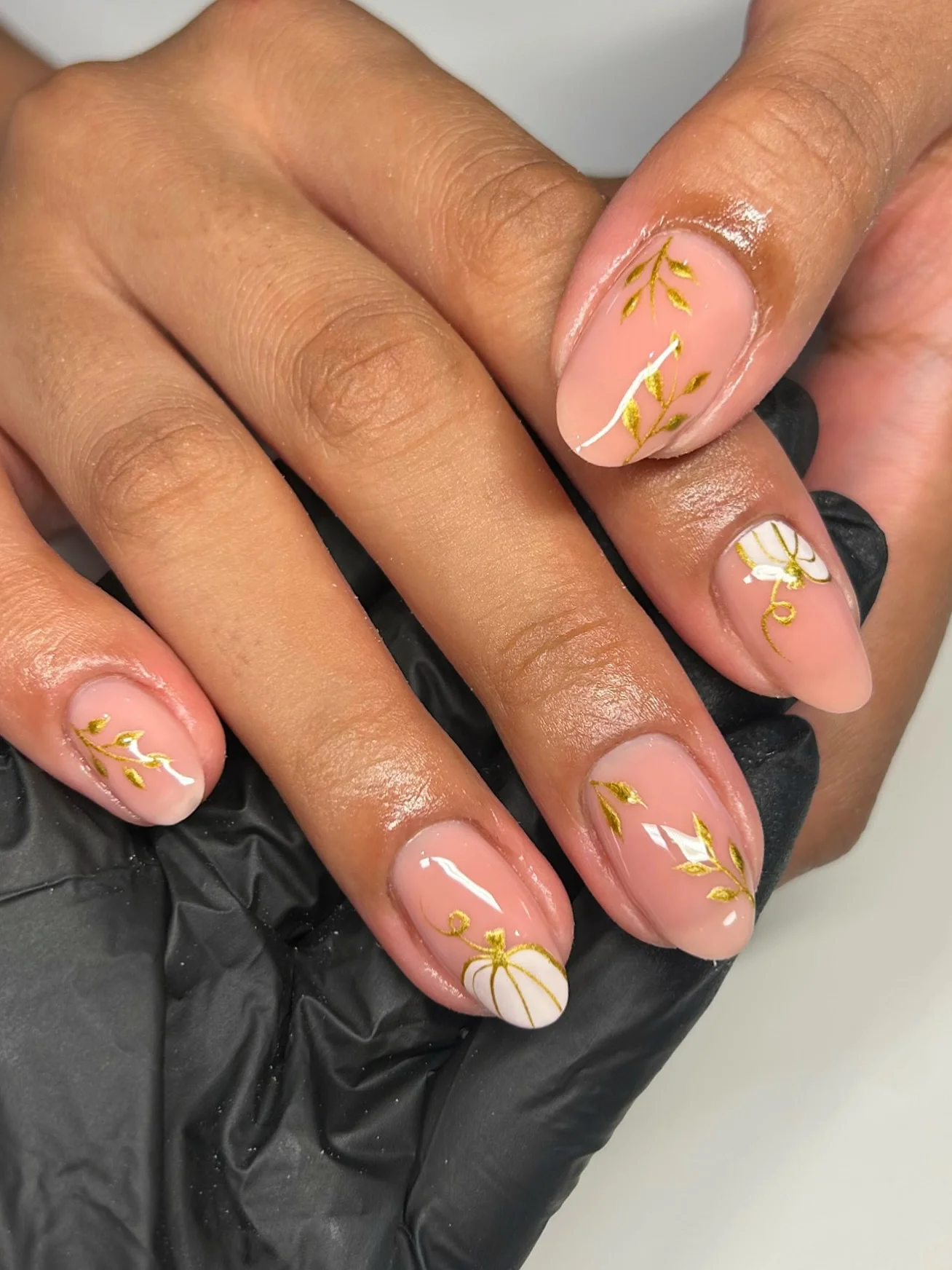 fall mid length nails 2026 Soft Blush Botanical Nails With Golden Pumpkin Accents