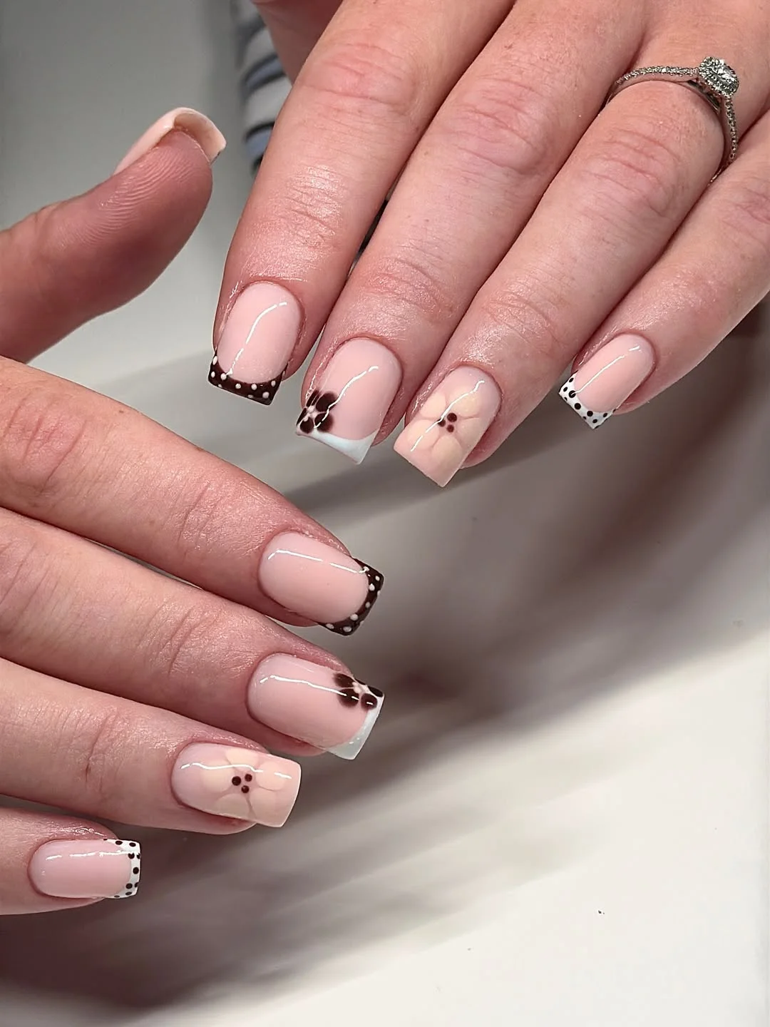 fall nails for pale skin 2026 Soft French Tips With Chocolate Brown Polka Dots