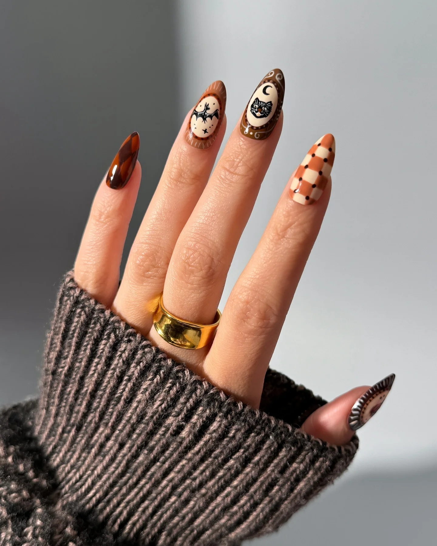 halloween nail art 2026 Vintage Halloween Almond Nails In Chocolate Brown