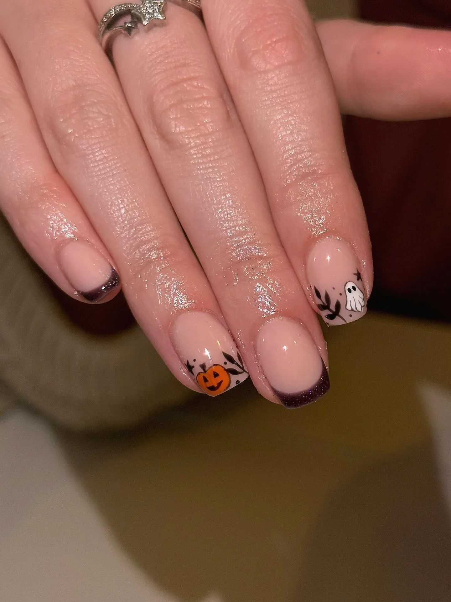 halloween nails designs 2026 Delicate Ghosts And Tiny Pumpkins On A Soft French Manicure