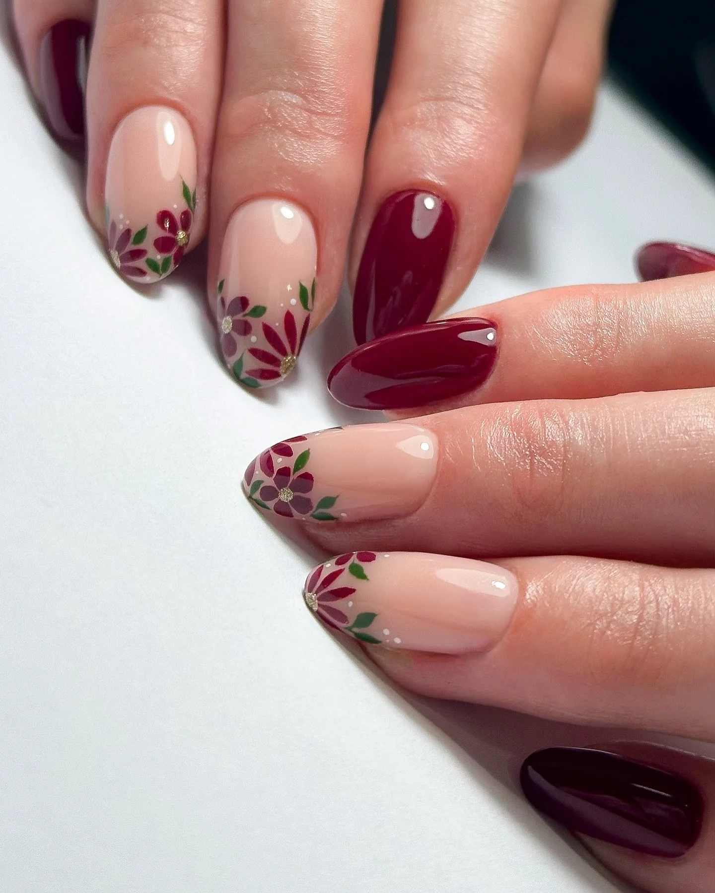 maroon fall nails 2026 Soft Nude Nails With Tiny Burgundy Floral Details