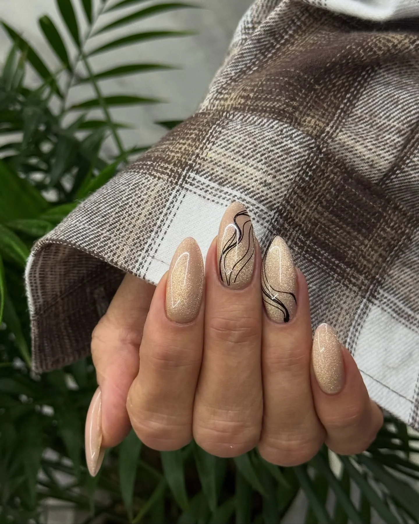 nude fall nails 2026 Champagne Nude Almond With Delicate Black Curves