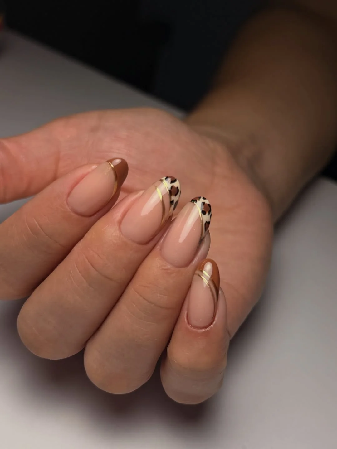 brown fall nails 2026 Elegant Nude French With Leopard Accent Tips