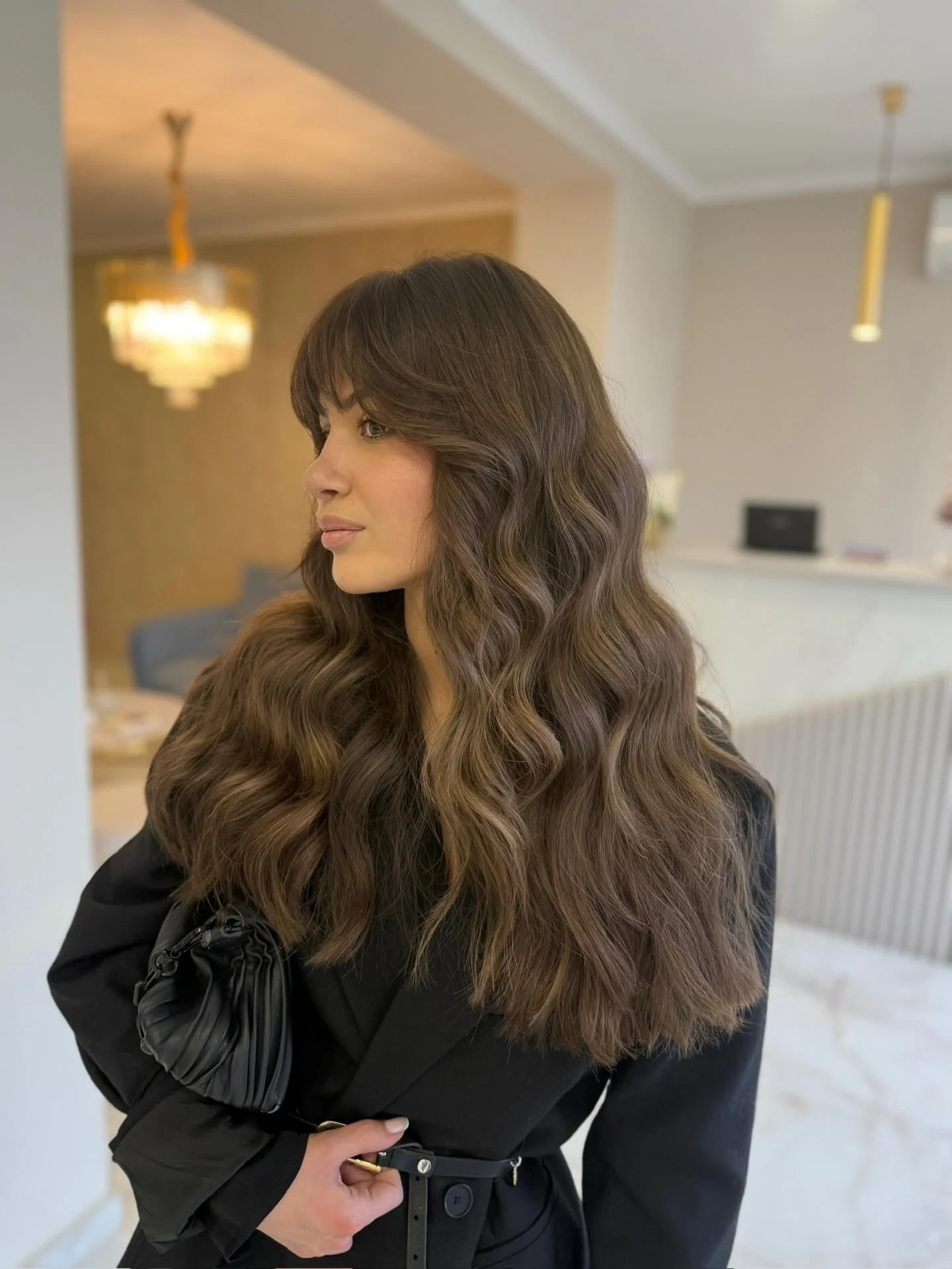fall brown hair color ideas 2026 Soft Cocoa Brown With Wispy Curtain Bangs