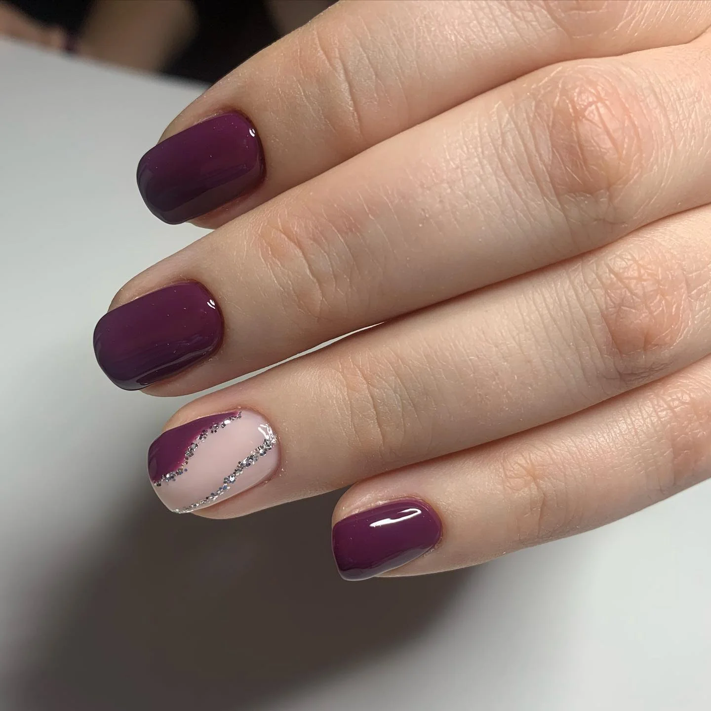 fall nails for fair skin tones 2026 Plum Burgundy With A Silver Geometric Accent