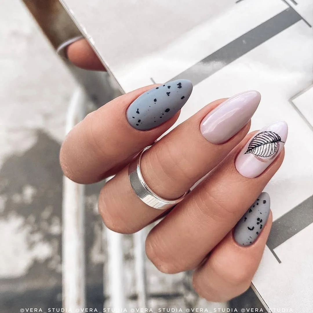 fall nails with autumn designs Cool Blue Speckled Nails With A Delicate Leaf