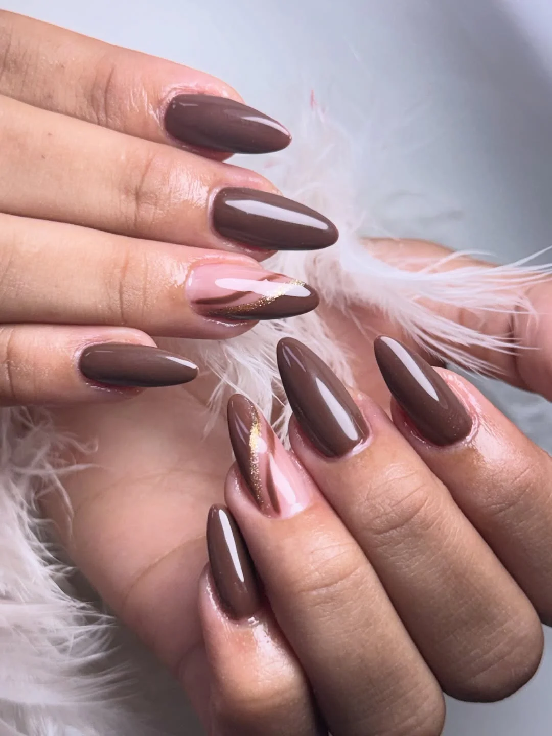 brown fall nails 2026 Glossy Cocoa Almond Nails With Gold Wave Accent