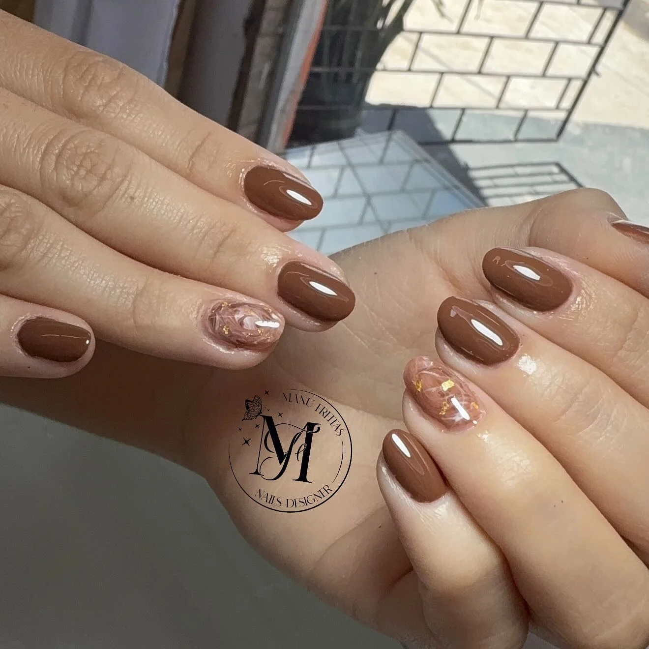 fall gel nails ideas 2026 Glossy Mocha Marble Accent Nails