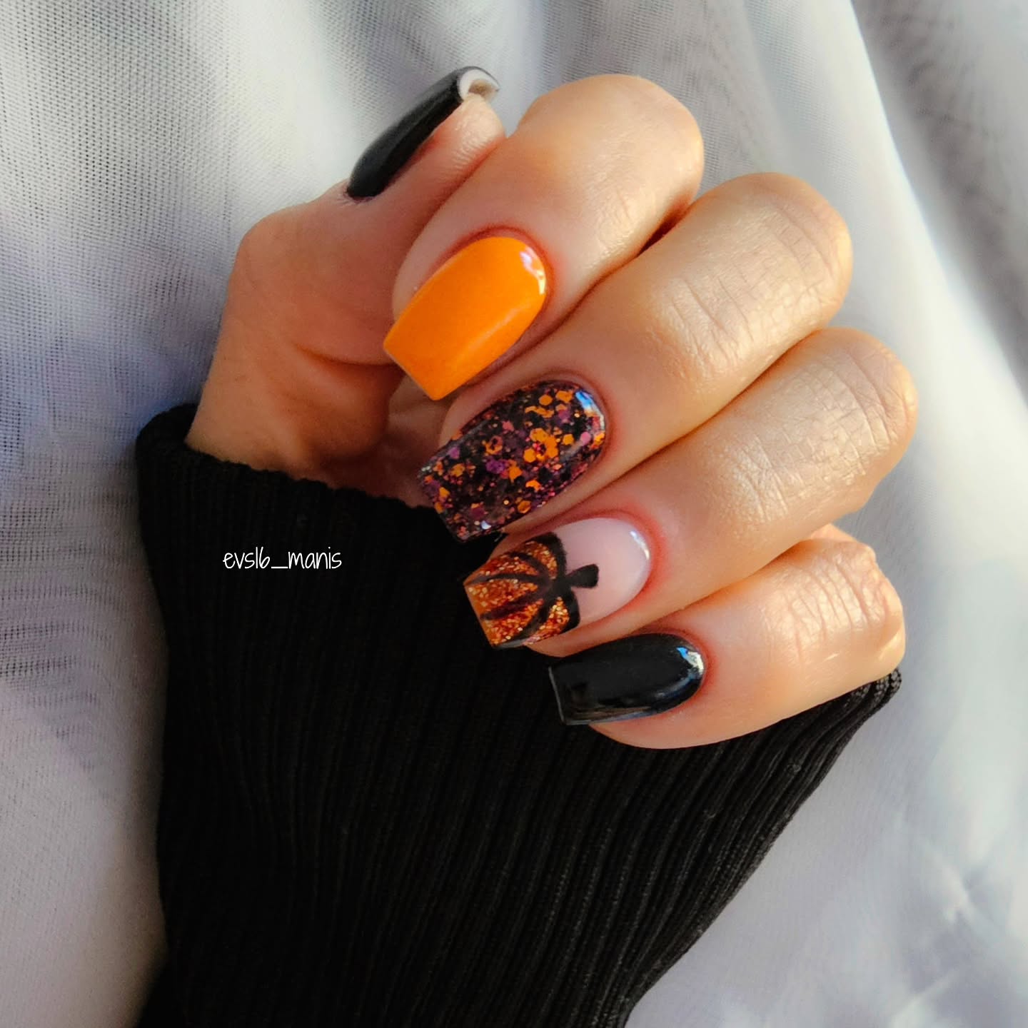 fall nail art ideas 2026 Orange And Black Nails With Sparkling Pumpkin Accents