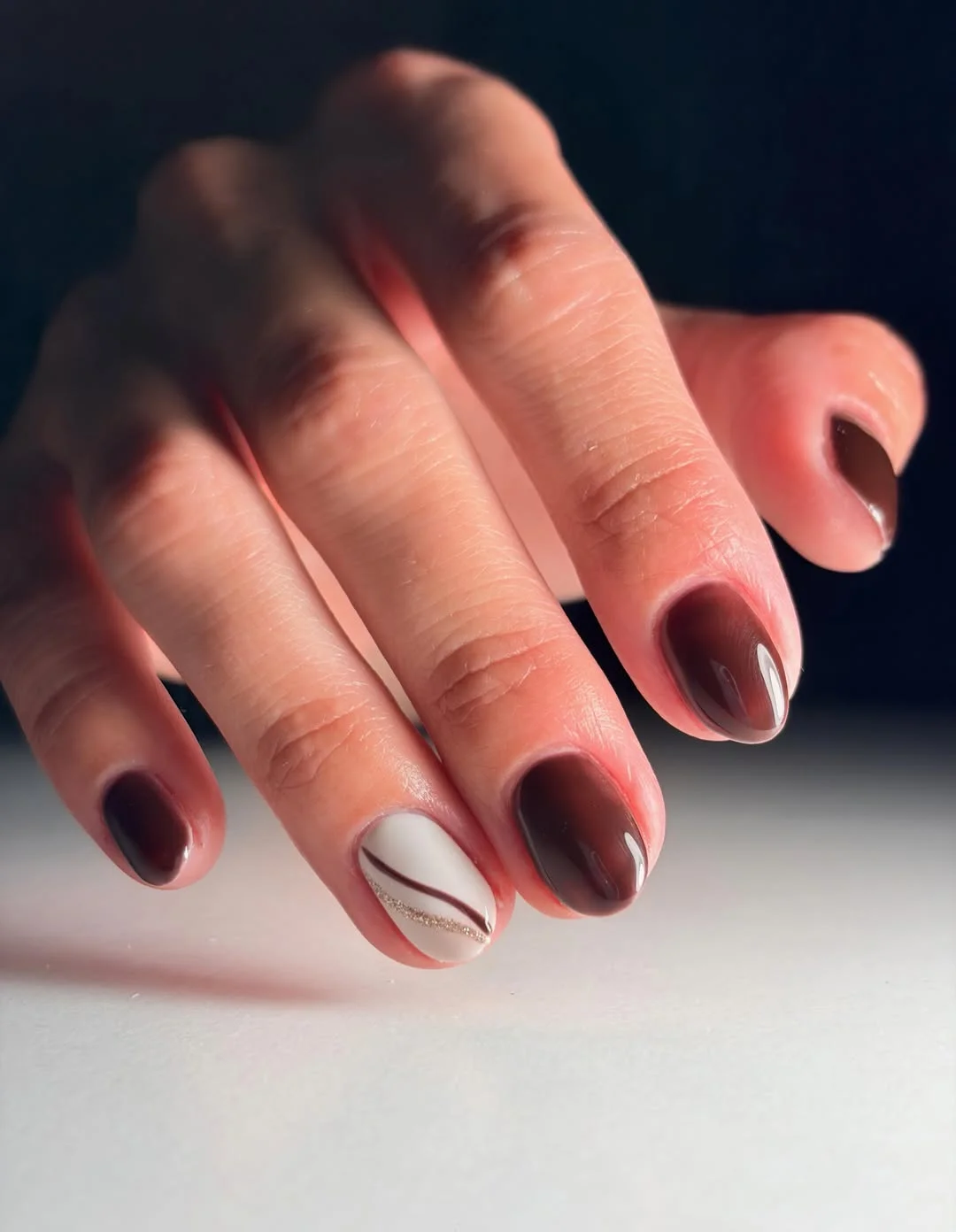 fall nail designs for office 2026 Dark Chocolate Accent Nails With Delicate Gold Curves