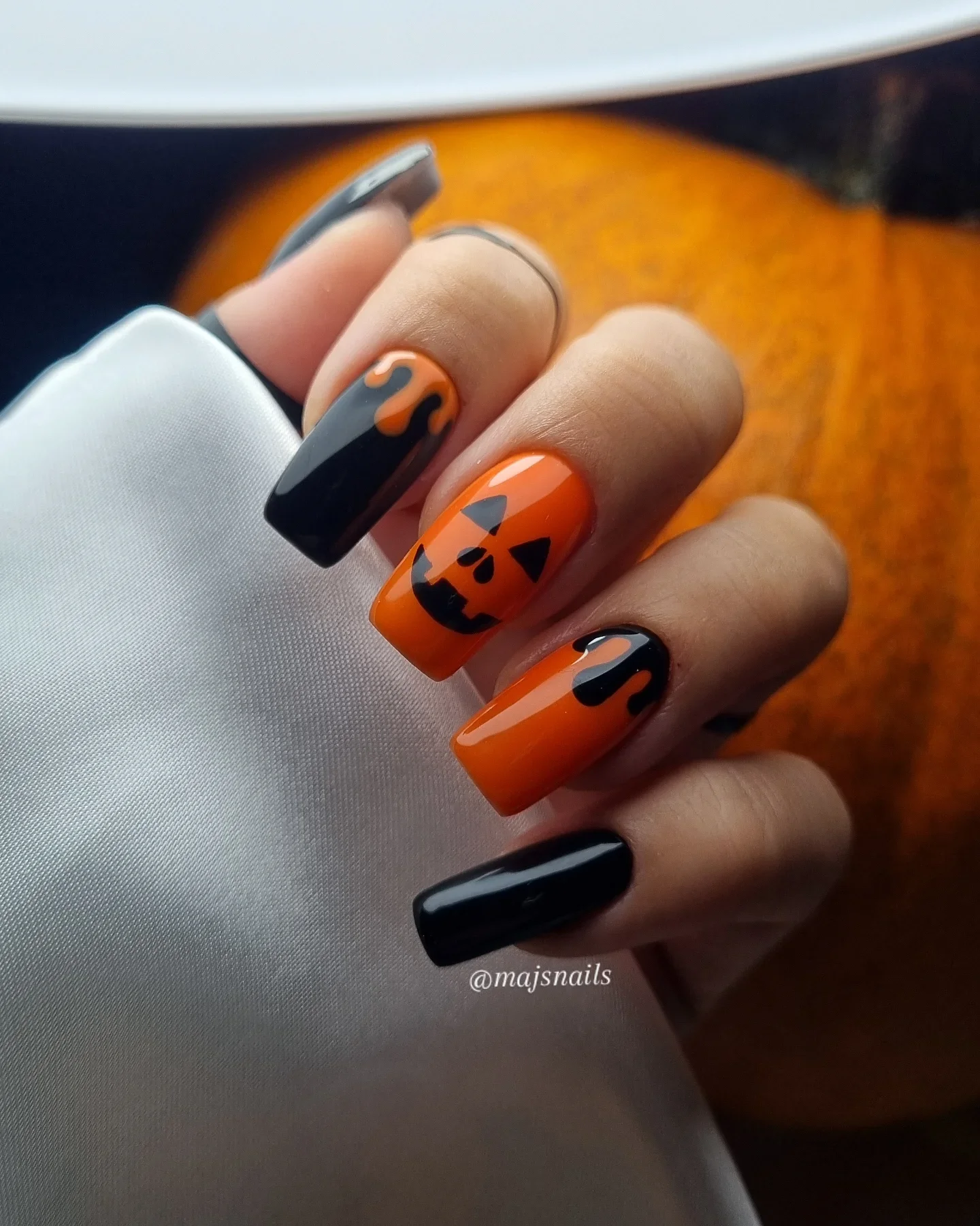halloween nails designs 2026 Glossy Orange And Black Jack O Lantern Nails