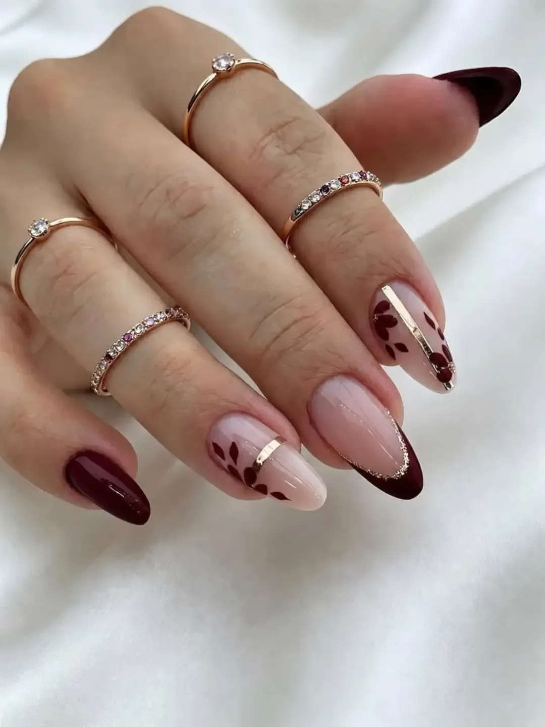 fall nails for pale skin 2026 Burgundy French Tips With Delicate Botanical Details