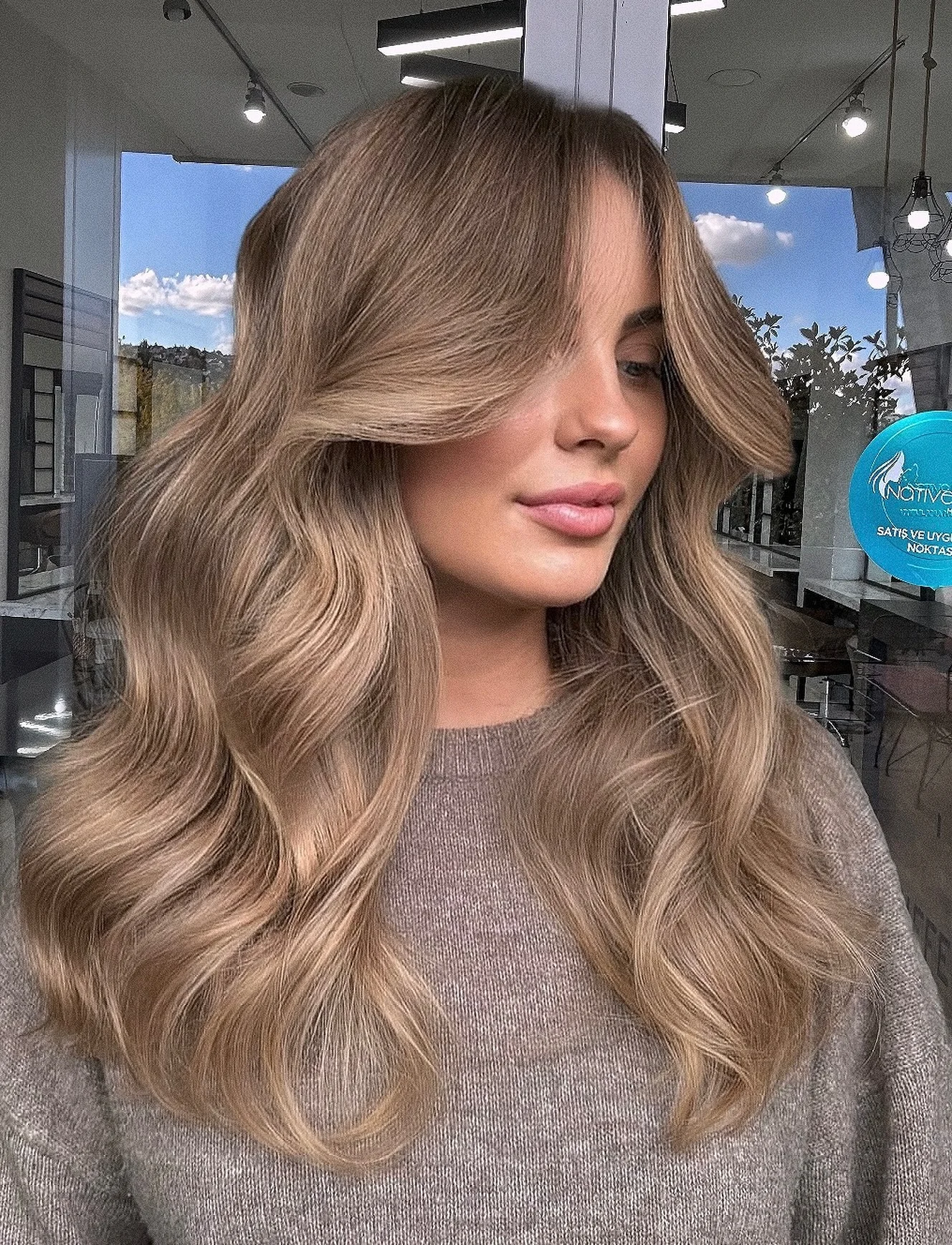 september hair color trends 2026 Soft Mushroom Bronde With Face-Framing Volume