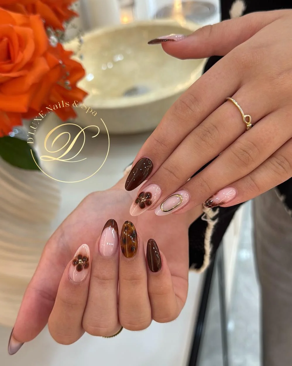 dark fall nails 2026 Glossy Mocha Floral Almond Nails