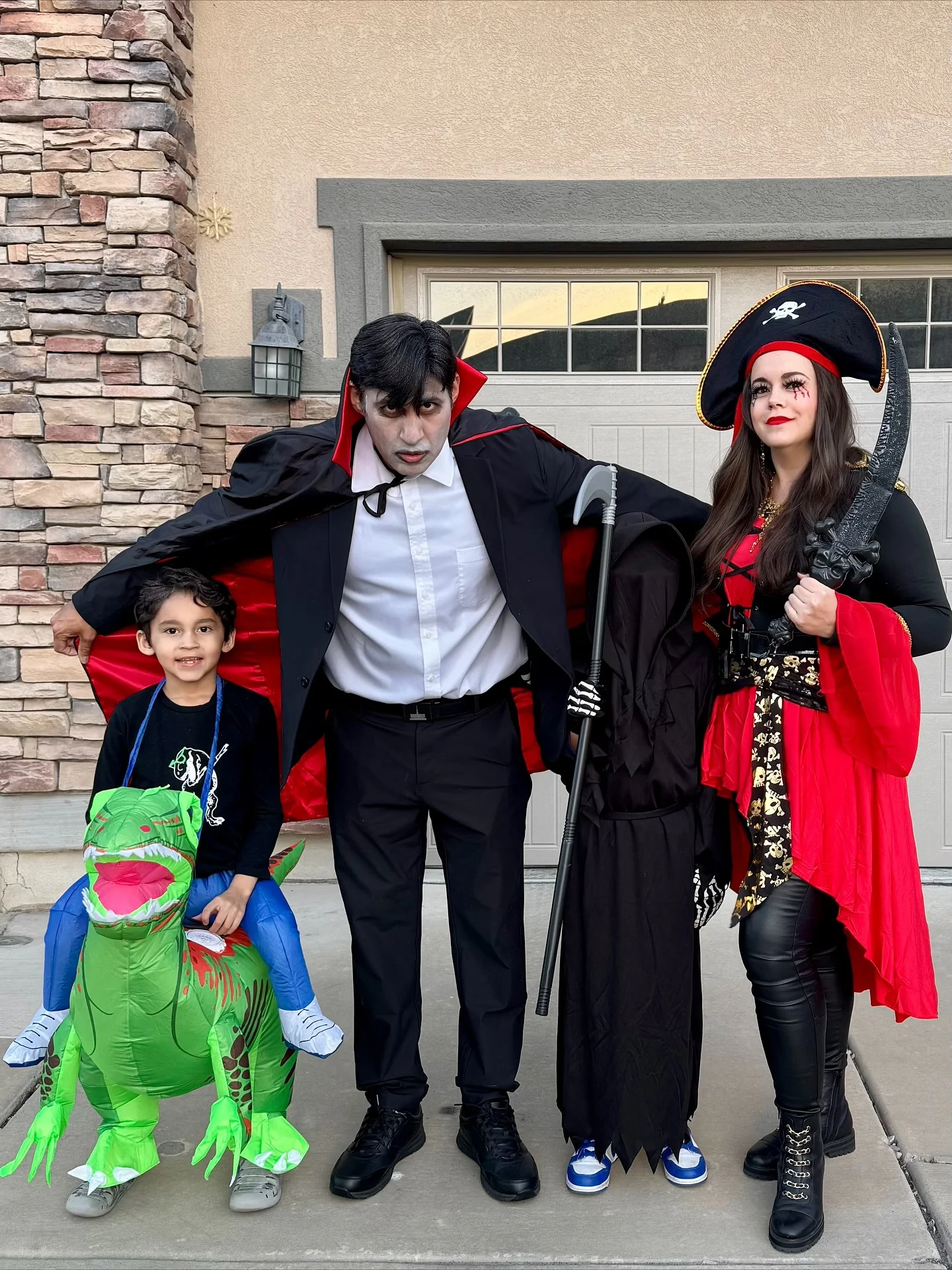 trendy halloween outfits 2026 Gothic Pirate Family With Dramatic Red Details