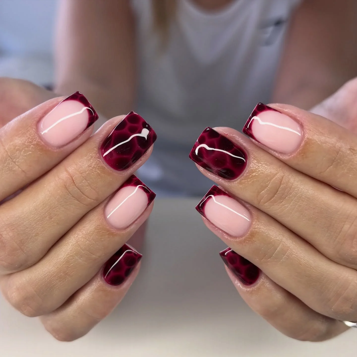 fall burgundy nails with design Burgundy French Tips With Abstract Curved Details