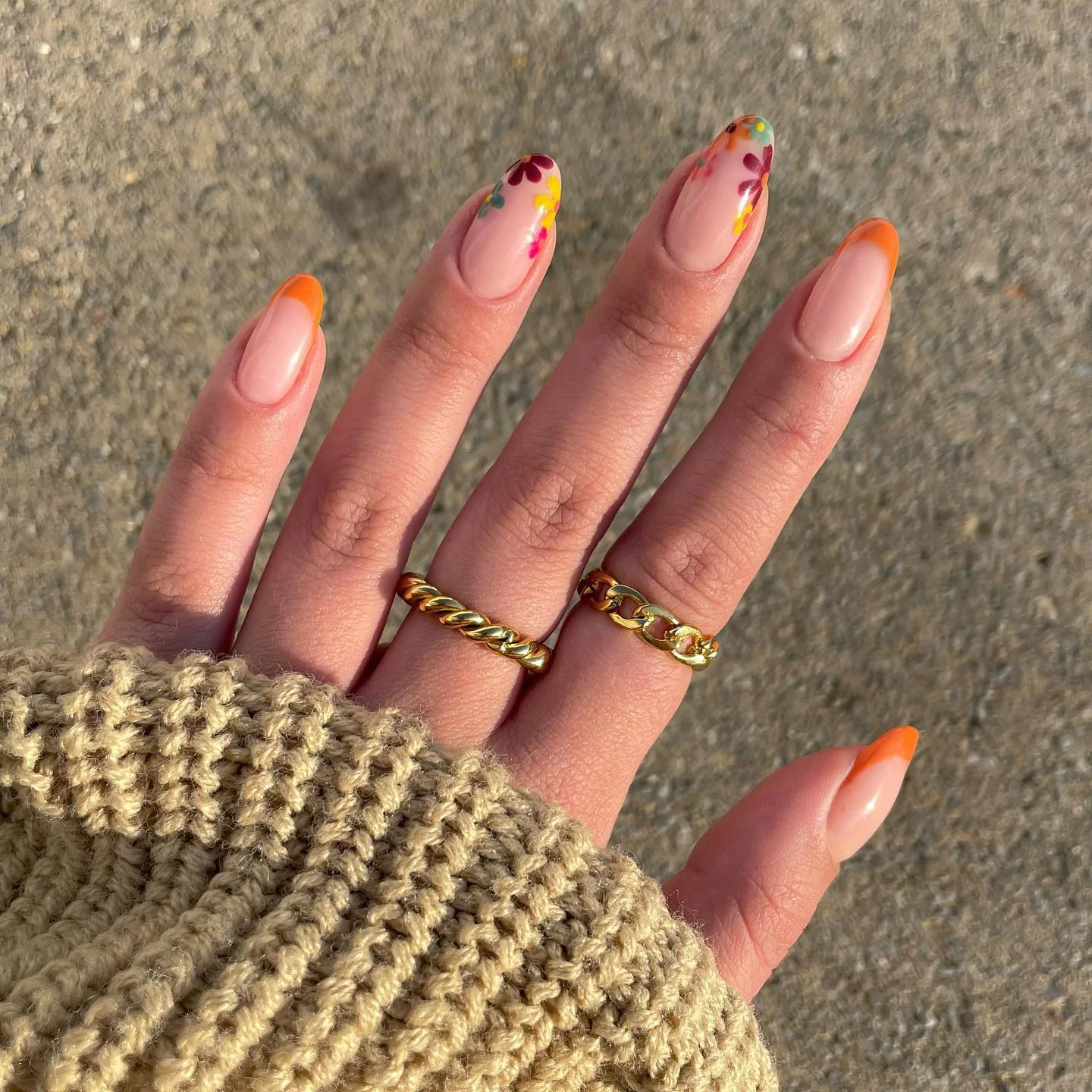 fall mid length nails 2026 Bright Orange French Tips With Playful Floral Accents