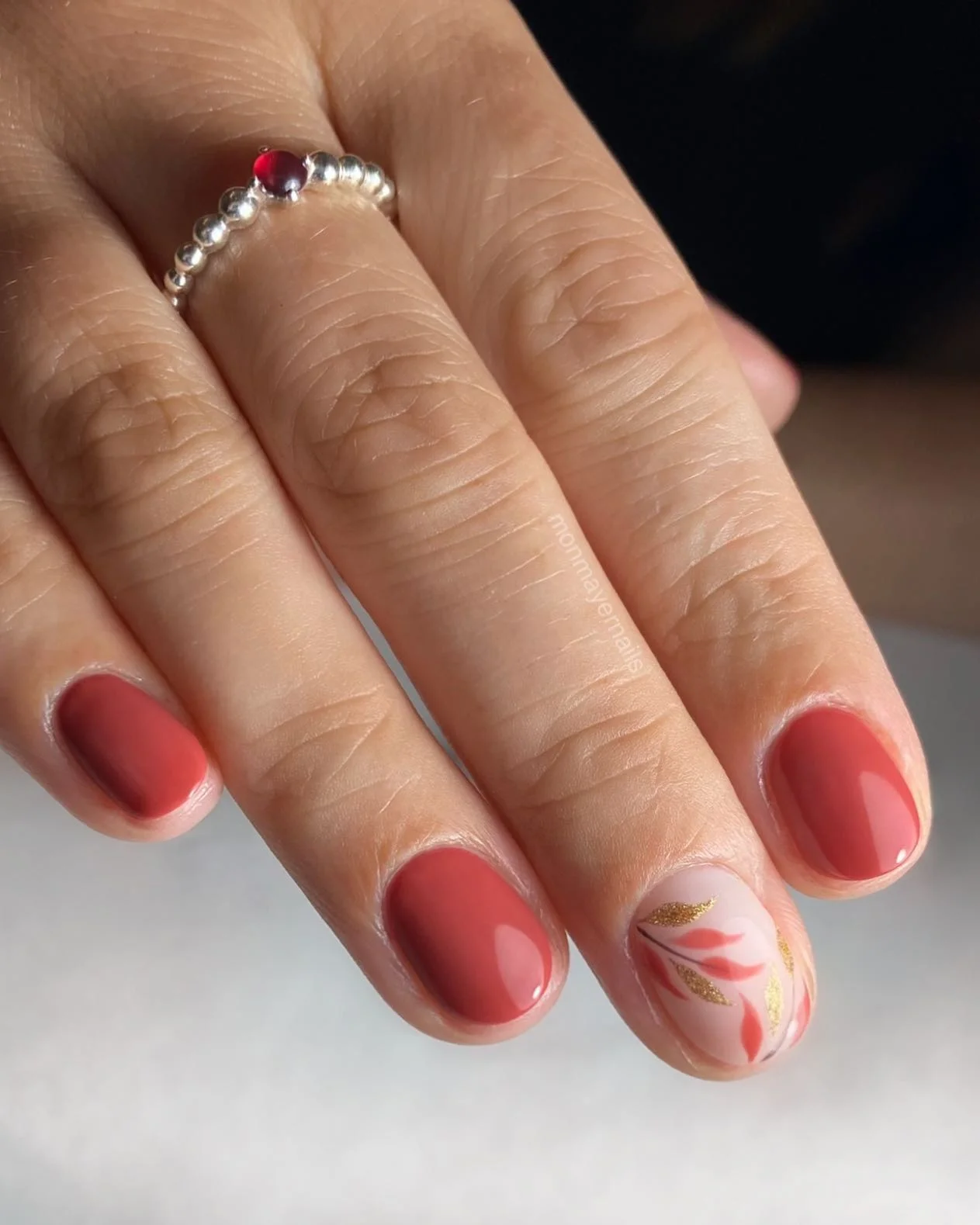 fall nails for fair skin tones 2026 Terracotta Red With Delicate Botanical Gold Details