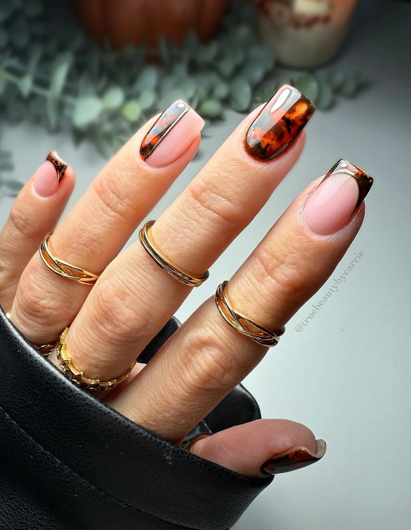 fall nails for pale skin 2026 Tortoiseshell French Tips With A Sleek Metallic Edge