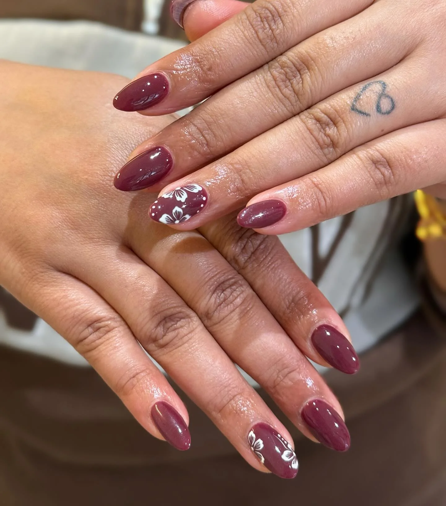 fall gel nails ideas 2026 Plum Floral Almond Nails For Cozy Days