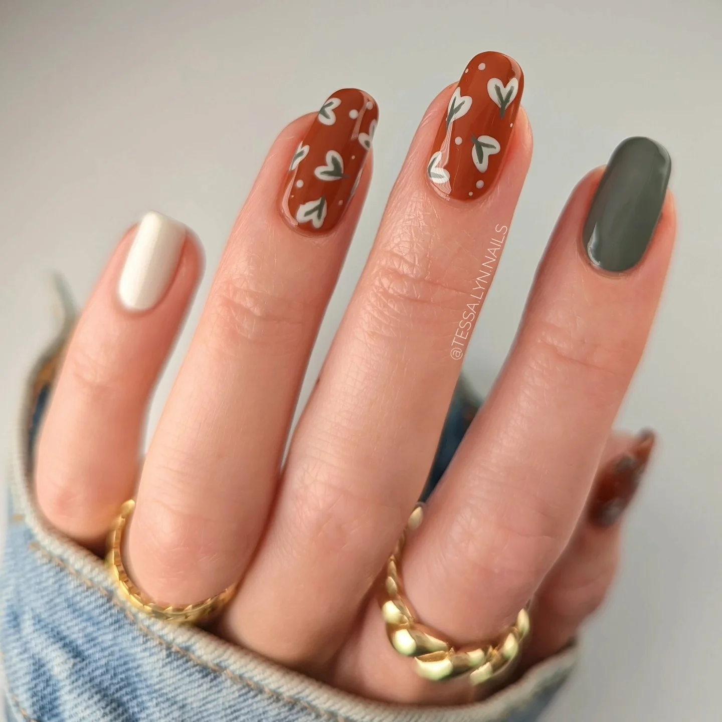 fall nails for pale skin 2026 Rusty Red Nails With Tiny Hand-Painted Hearts
