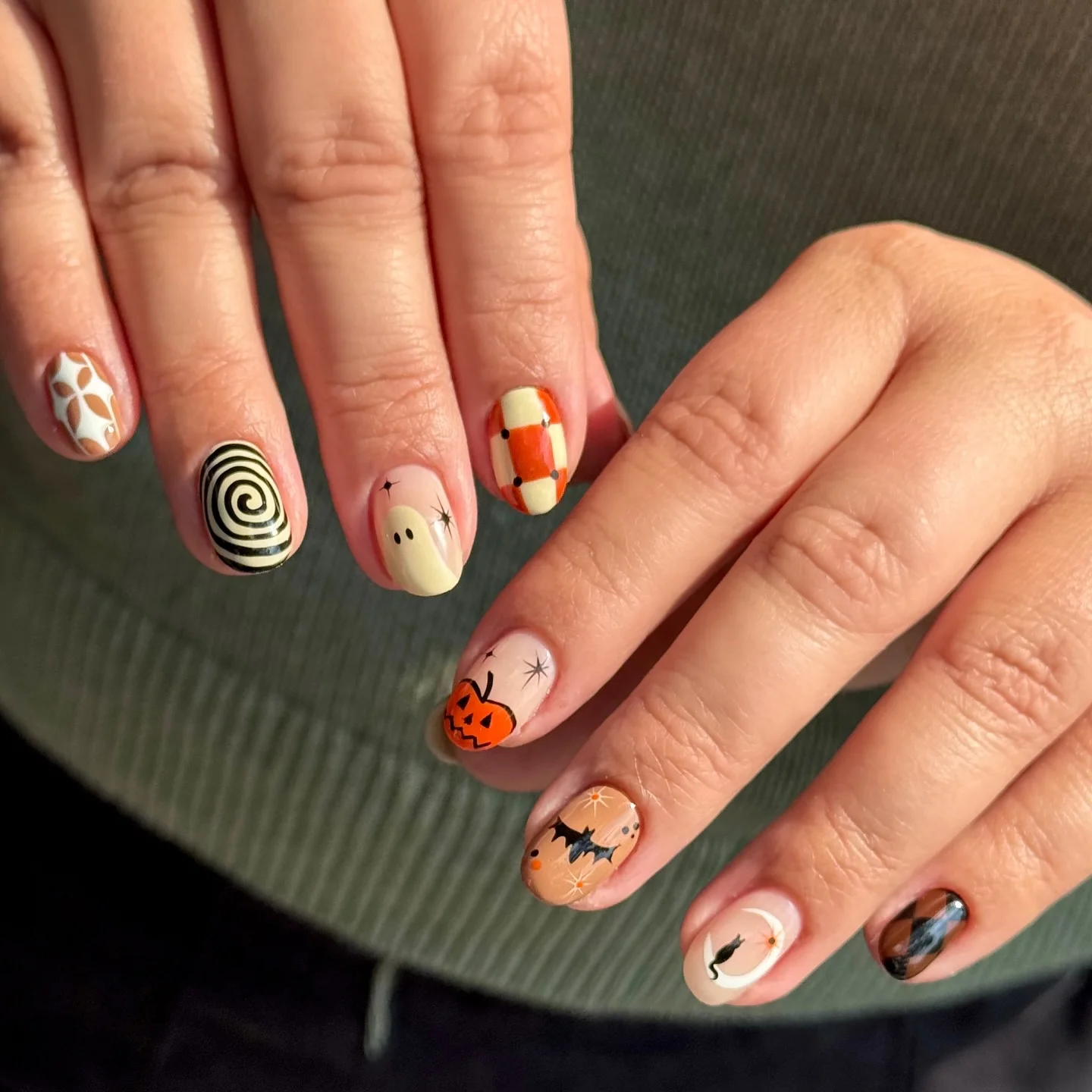 halloween nails designs 2026 Retro Halloween Mix With Pumpkins Bats And Swirls