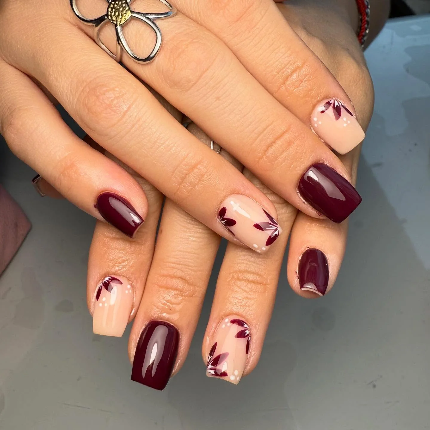 fall burgundy nails with design Burgundy And Nude Floral Nails With A Soft Romantic Finish