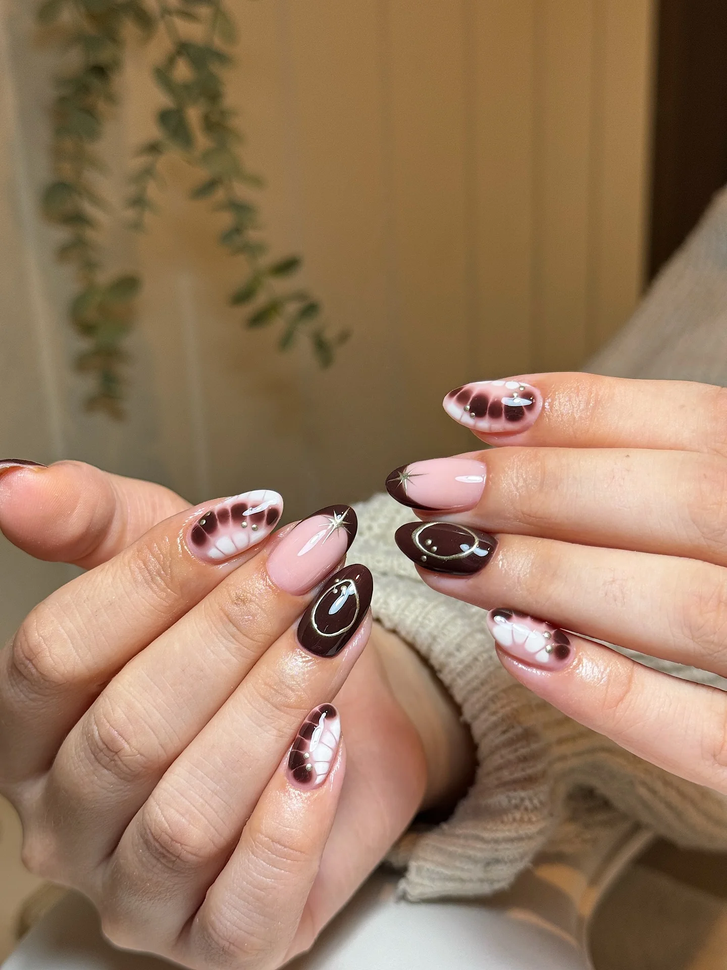 fall mid length nails 2026 Glossy Cocoa Swirls With Celestial Accents